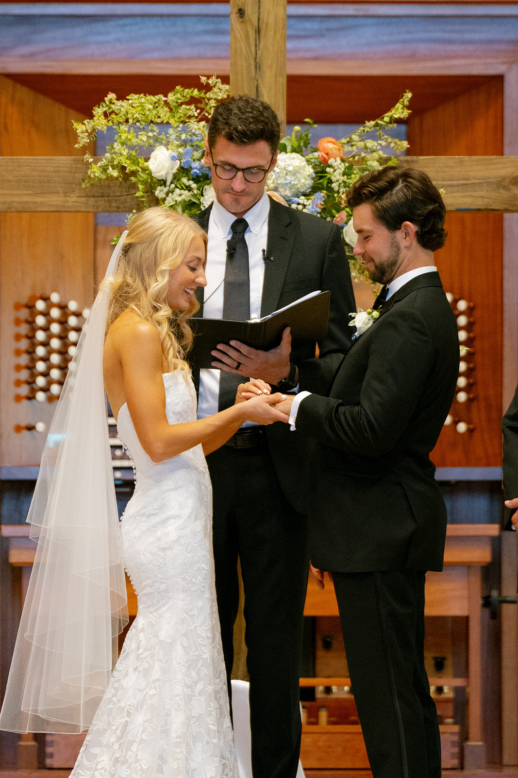 south Carolina couple exchanges wedding rings in a church
