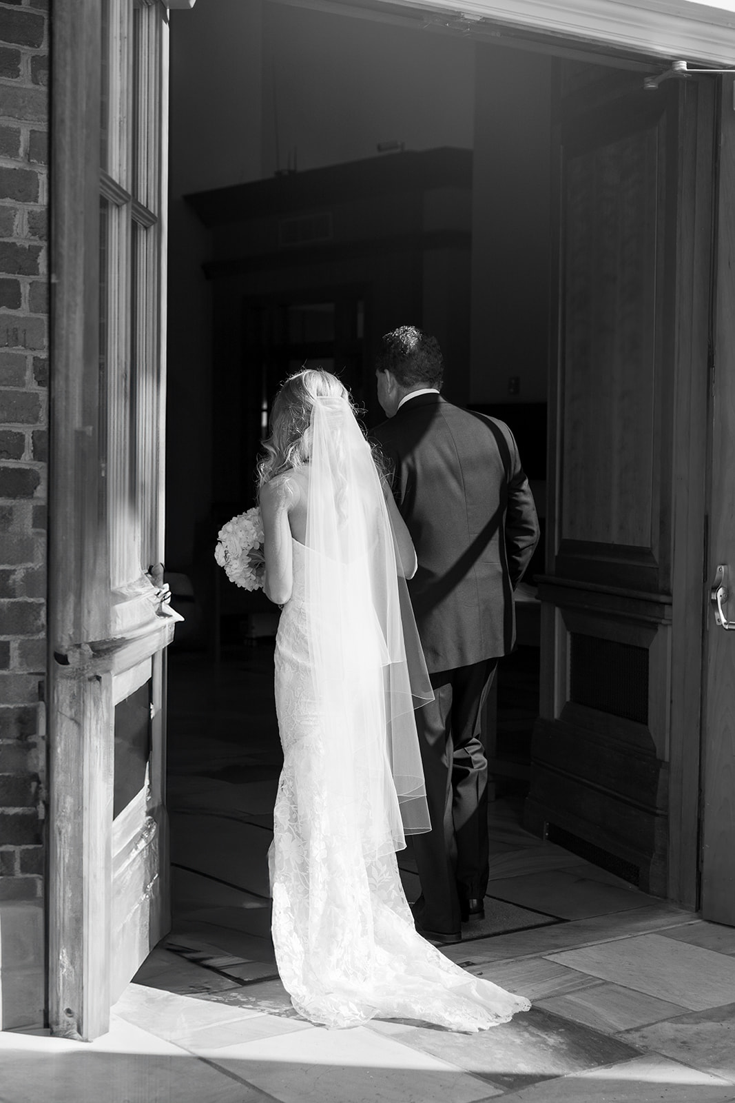 bride and her dad as they start to walk down the wedding aisle 