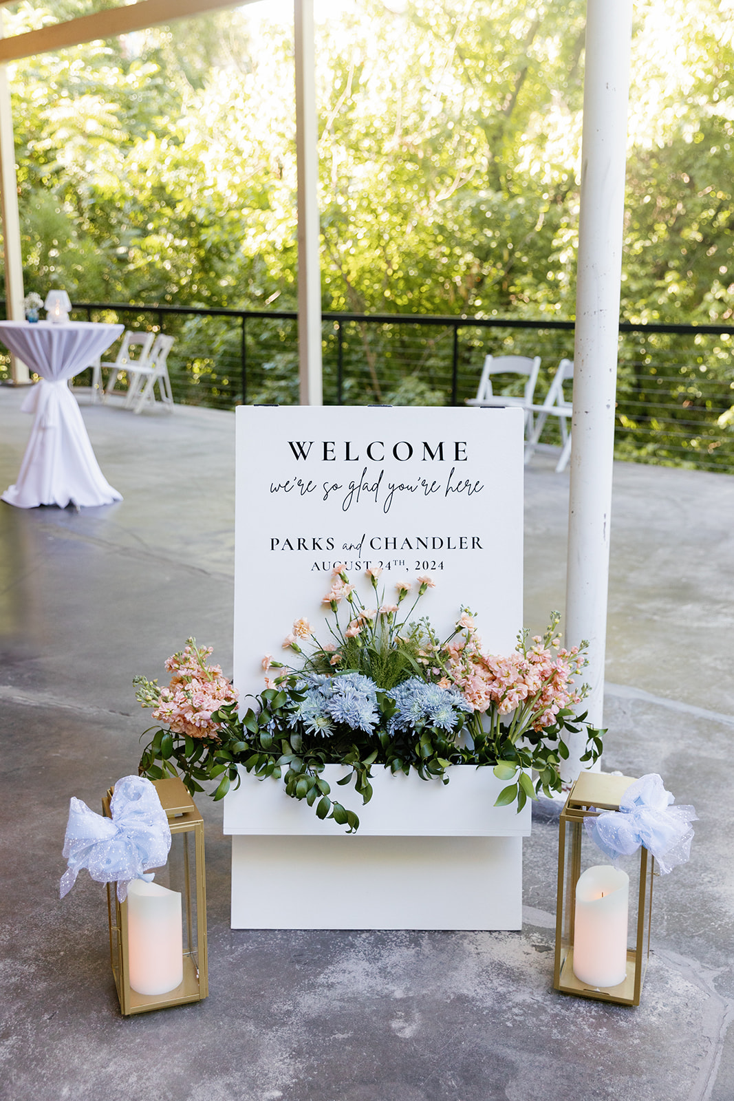 gorgeous welcome sign with pastel florals  as part of their wedding weekend timeline