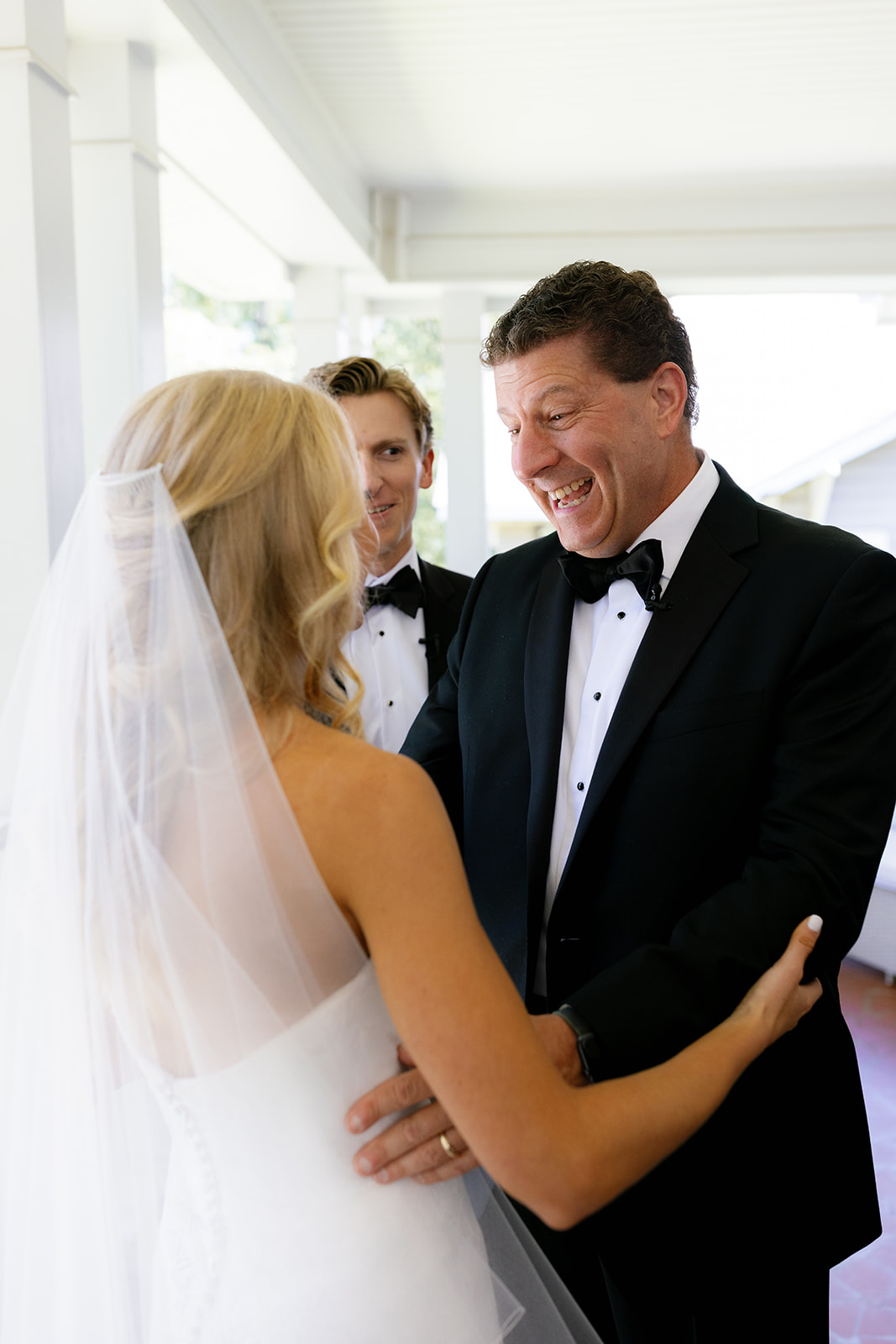 Bride’s father reacts with pure joy seeing his daughter in her wedding dress for the first time.