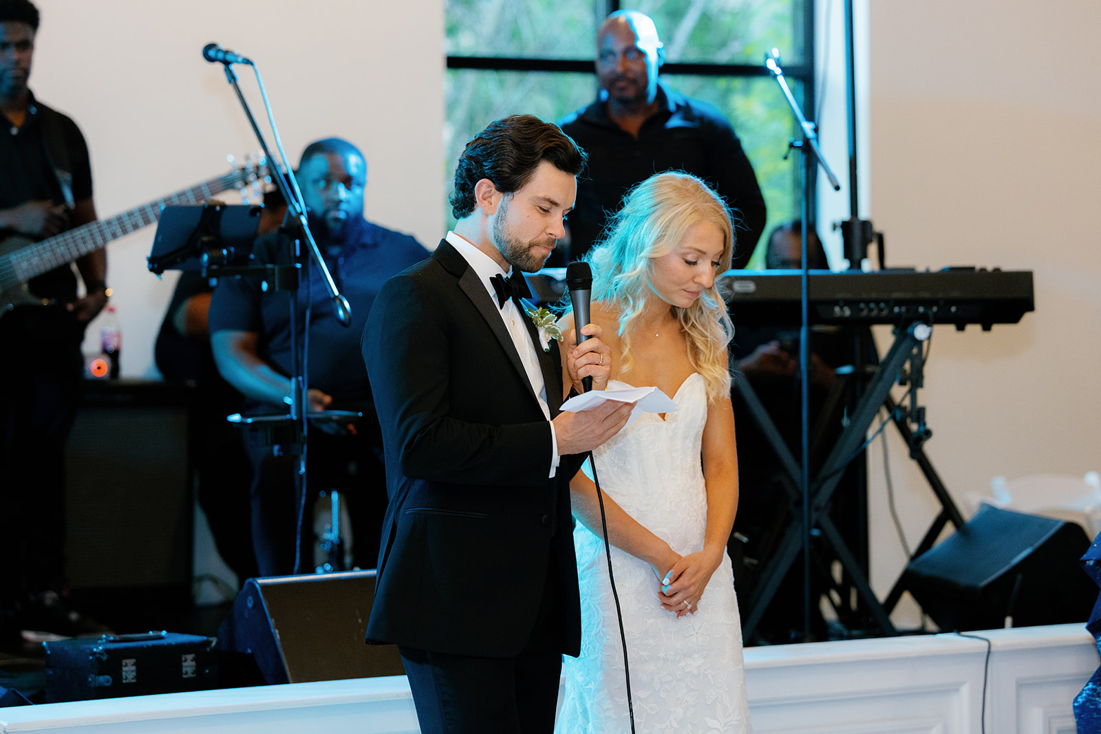 Groom giving a touching speech with the bride by his side, thanking guests for celebrating their wedding weekend.