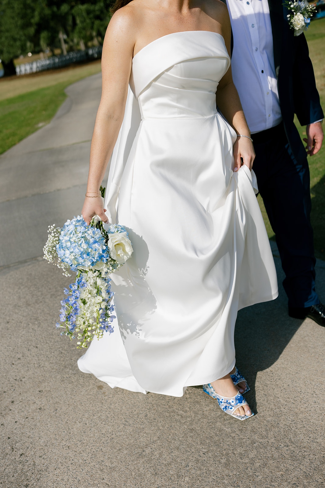 editorial wedding photo of the couple walking 