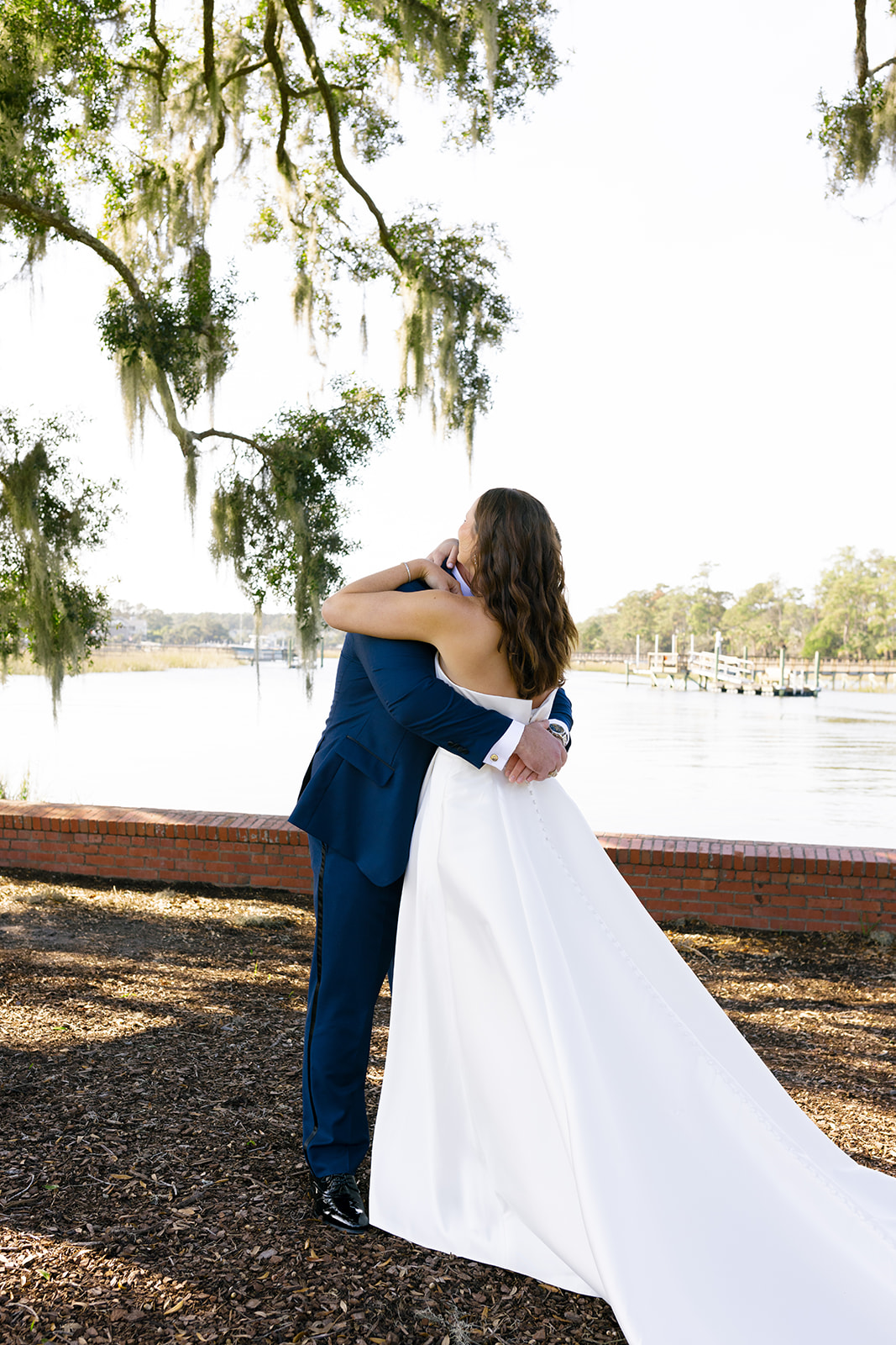 Mills and Brooks share an emotional embrace beneath Spanish moss after exchanging vows.