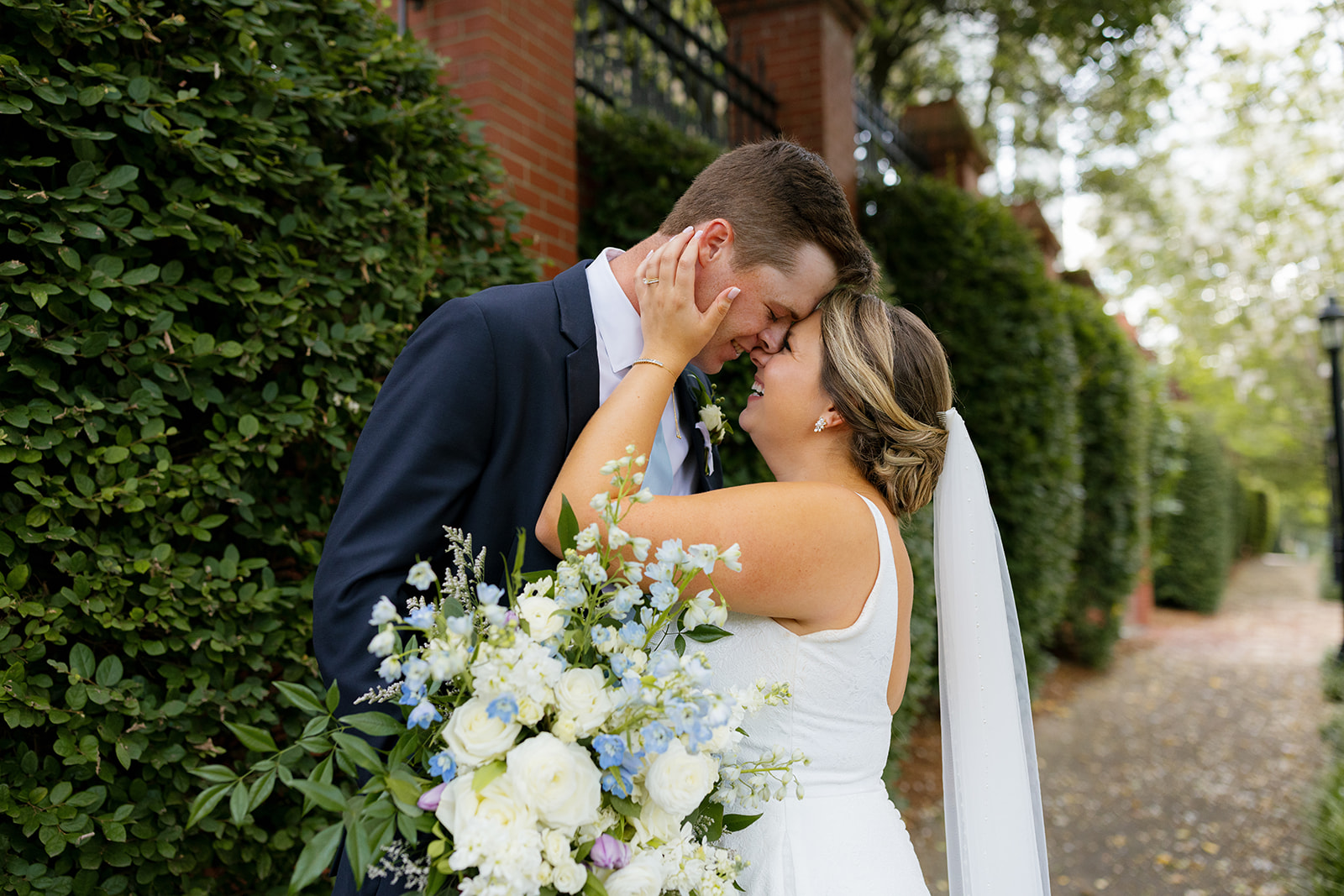 bride and groom putting their foreheads together sharing a moment 