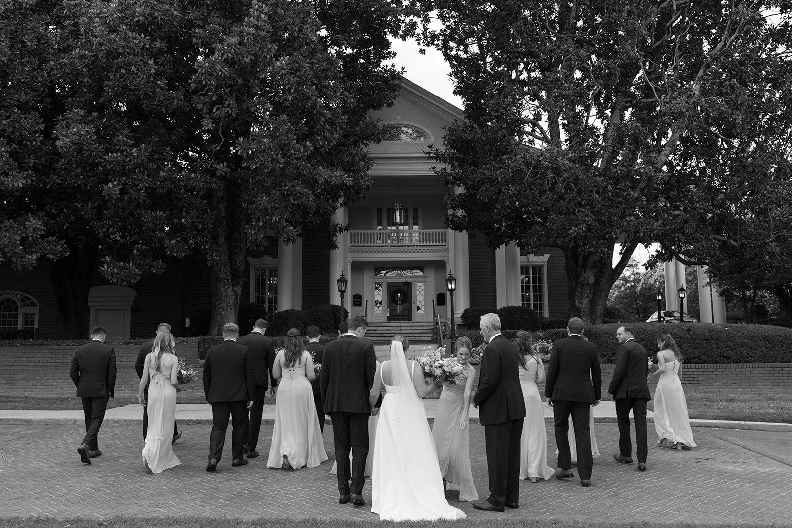 candid photo of the bridal party on the street 