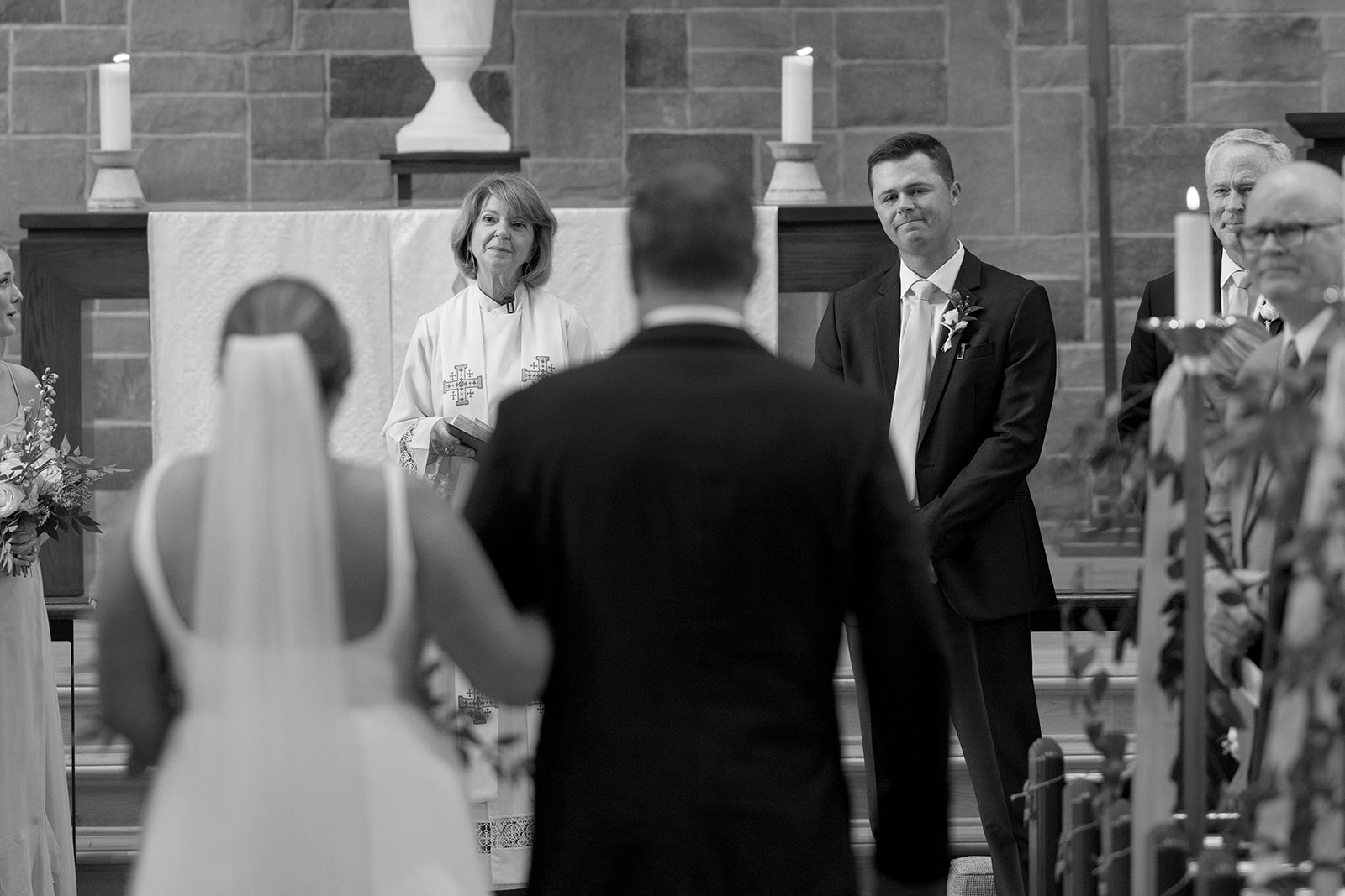 the groom's face as the bride walks down the aisle