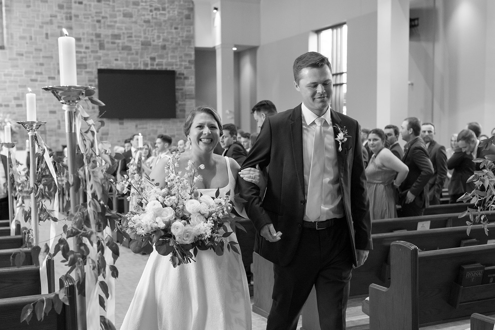 candid wedding photo of the bride and groom after the ceremony taken by a Greenville wedding photographer
