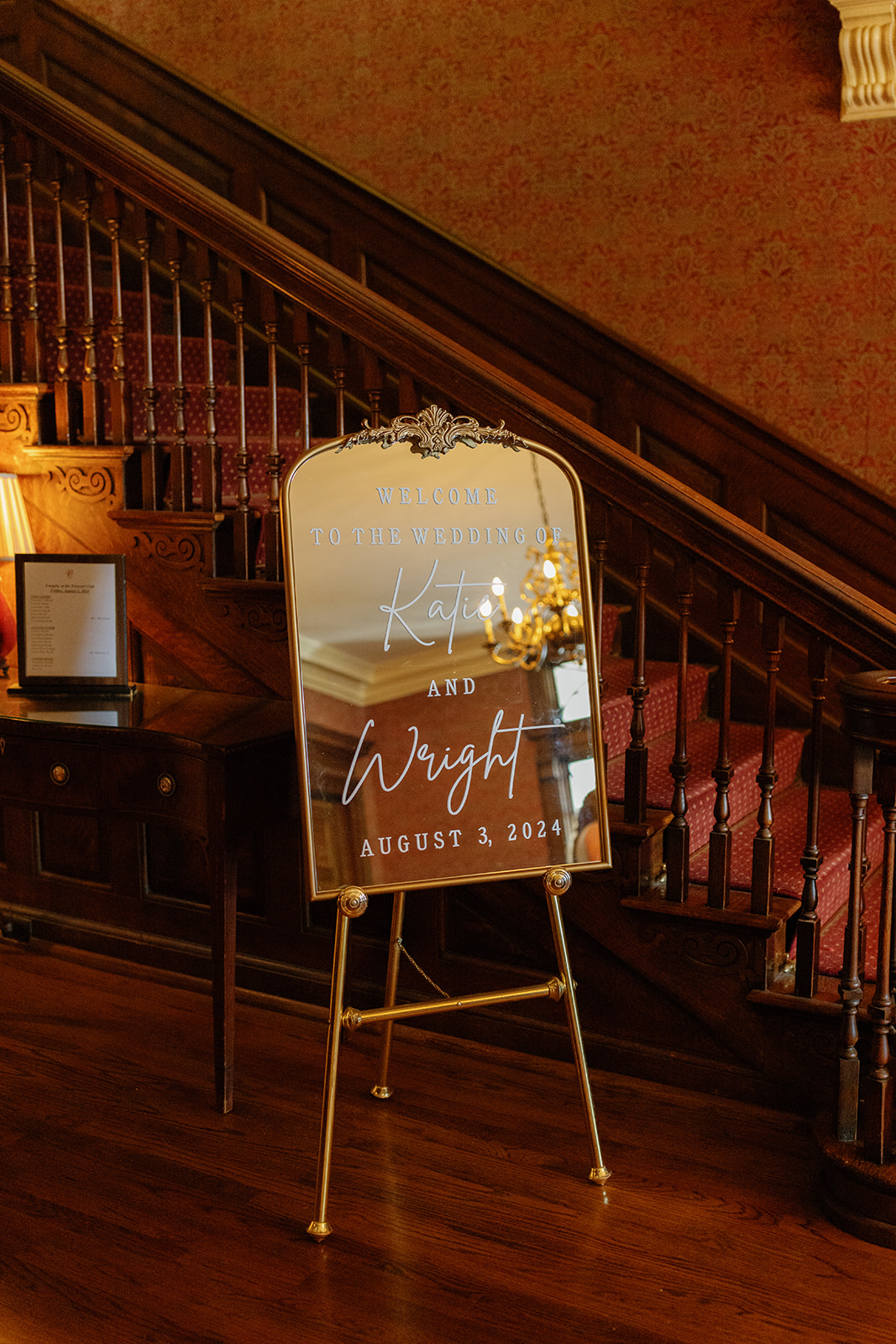 Mirror sign with elegant script welcomes guests to Katie and Wright’s romantic August wedding at the Poinsett Club.