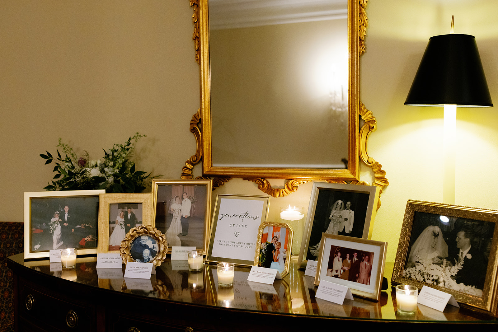 a table with photos of their family during their own weddings 