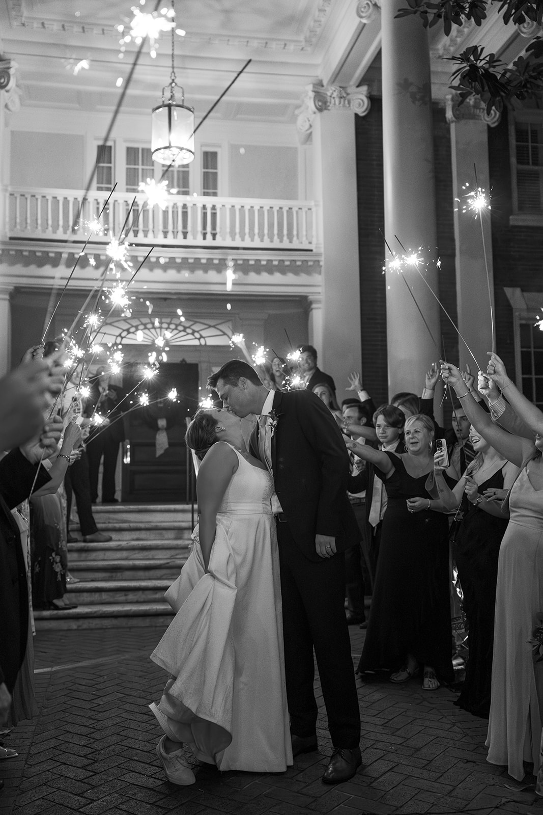 the couple kissing inside the sparkler exit taken by a Greenville wedding photographer
