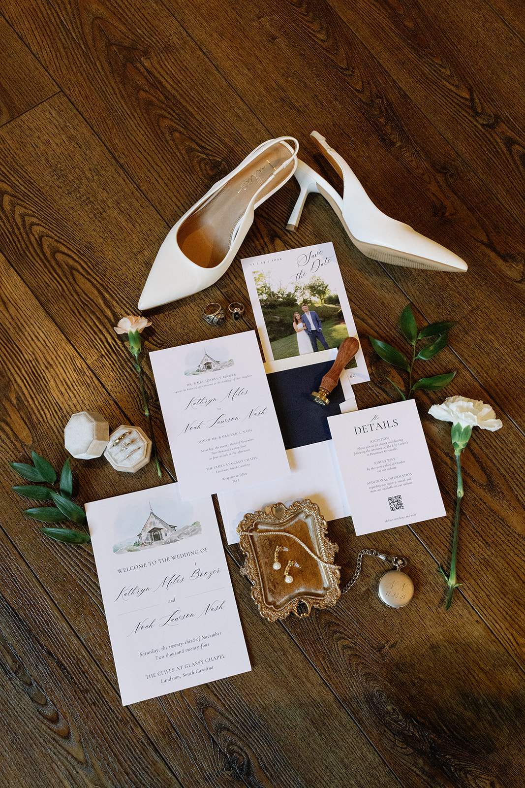 Flatlay of bride's heels, wedding details, and romantic invites for a timeless ceremony at Cliffs at Glassy Chapel.