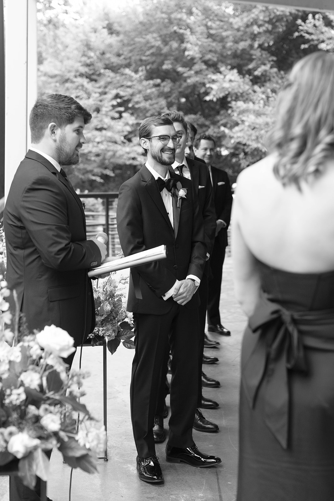 the groom's face as he sees the bride