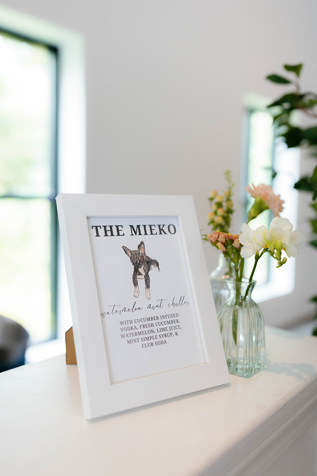 Custom bar sign featuring the couple’s dog and signature cocktail at a Greenville wedding venue.
