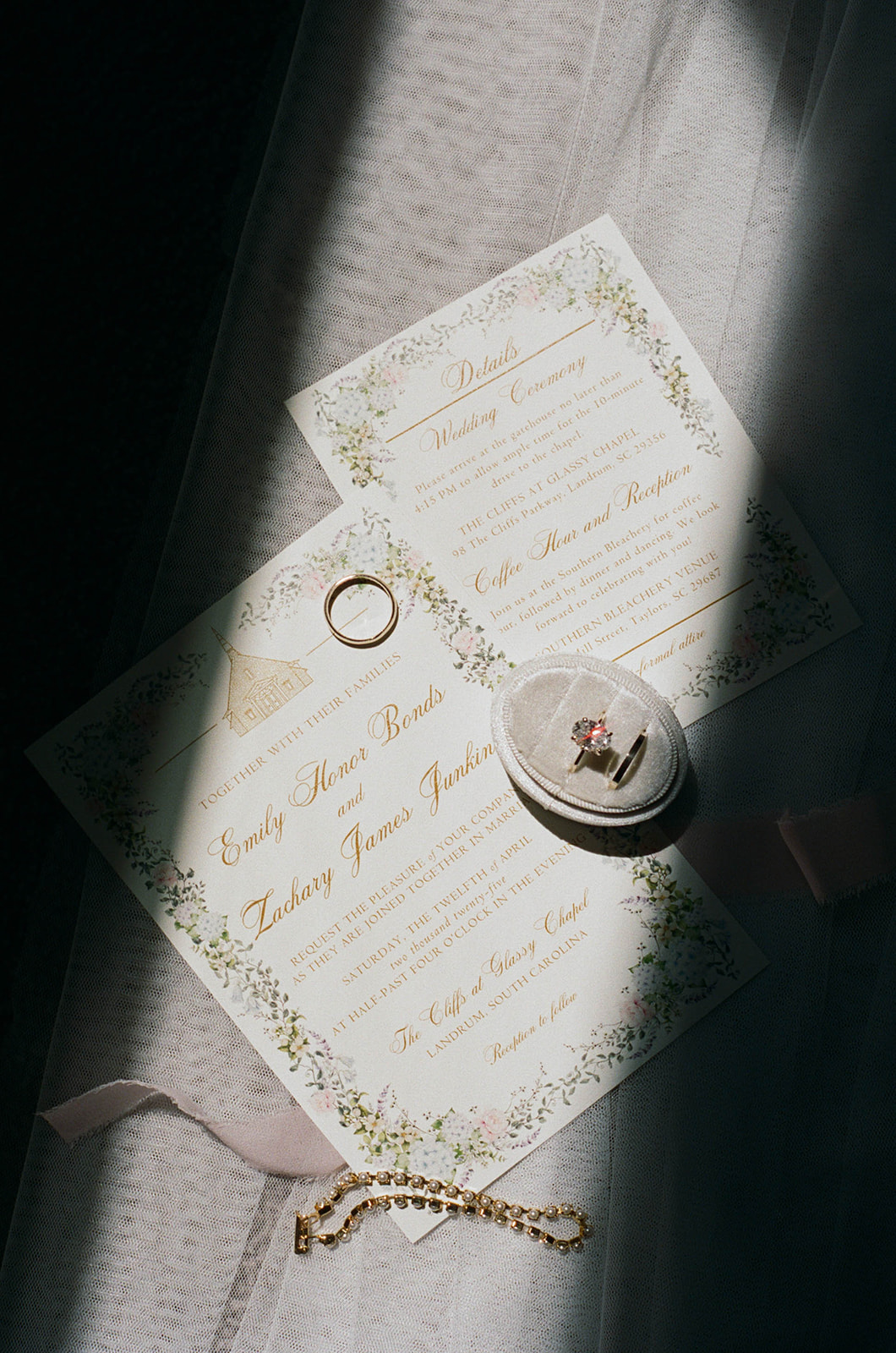 invitations and rings flatlay captured by a South Carolina wedding photographer