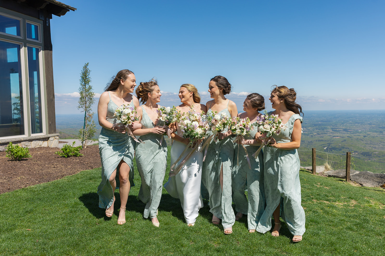 bridesmaids smile at the bride at Glassy Chapel