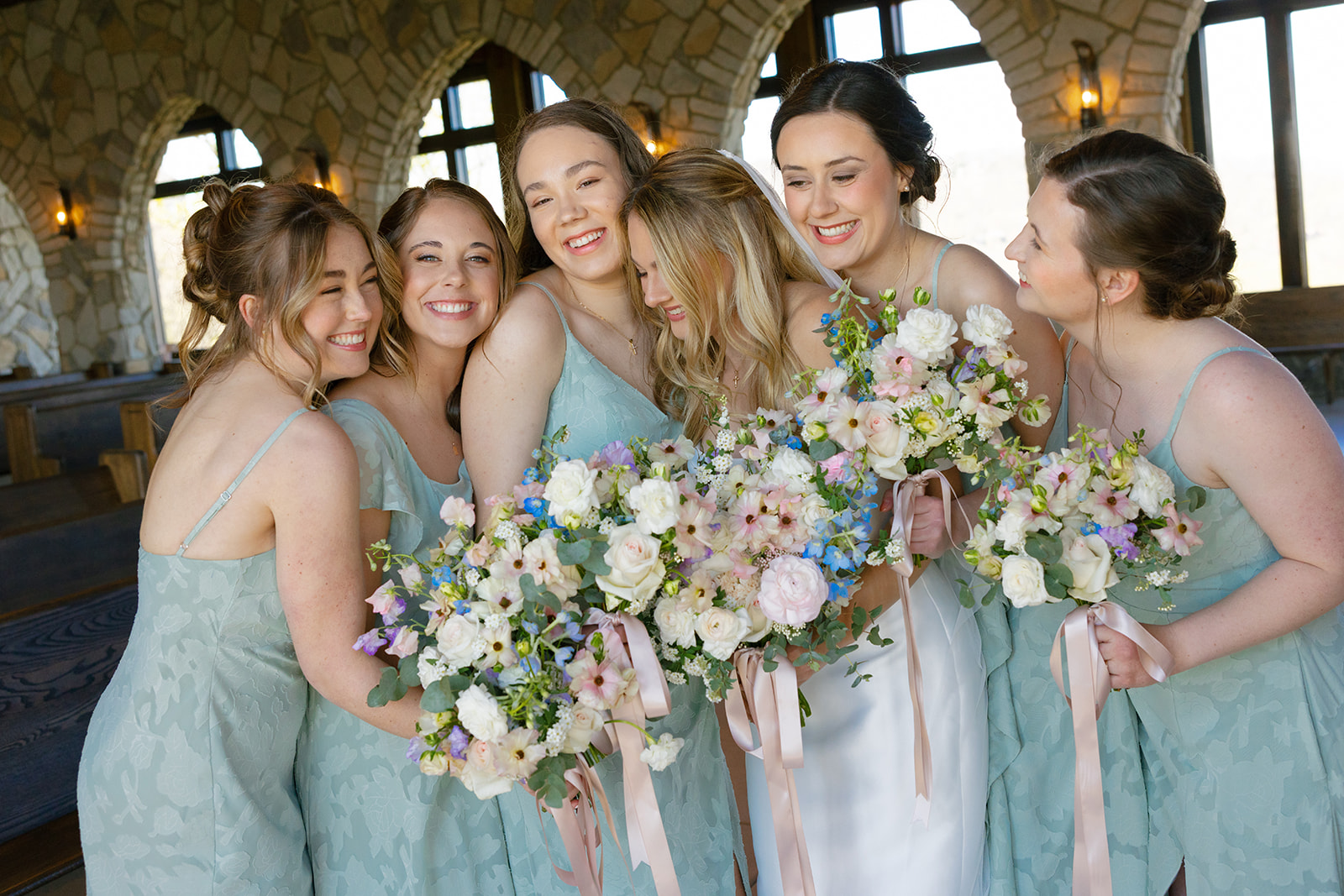 Bridesmaids smiling with bride at Glassy Chapel in South Carolina
