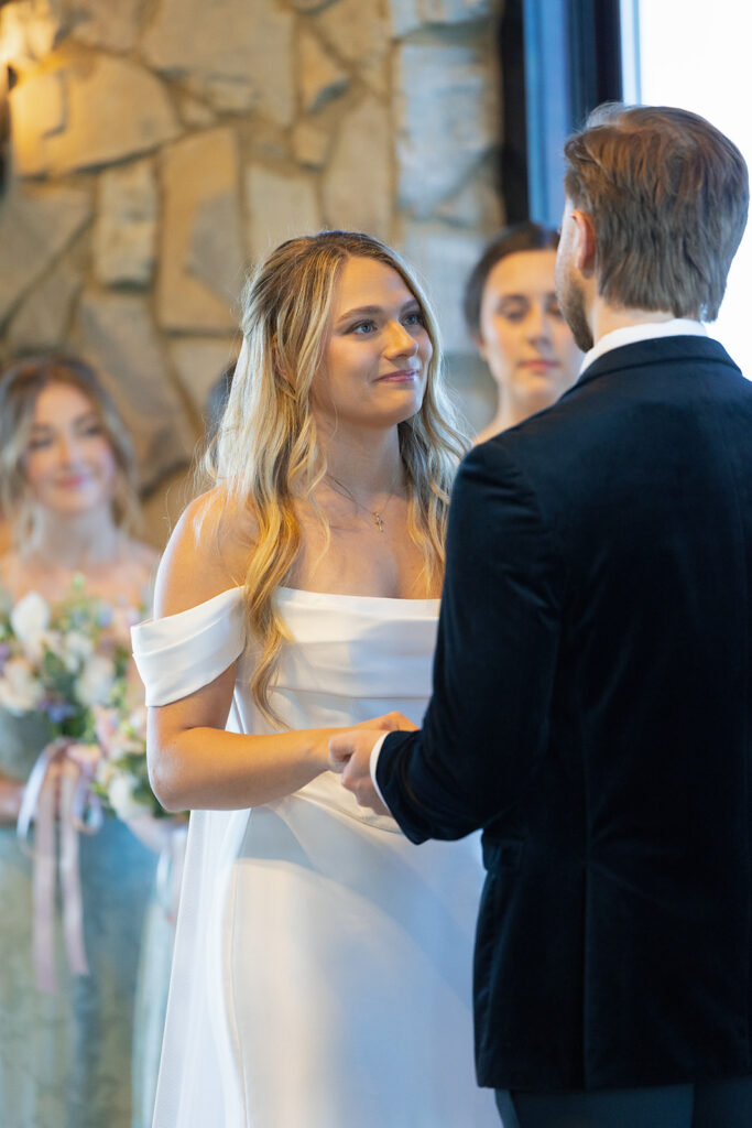 bride looking lovingly at groom during wedding