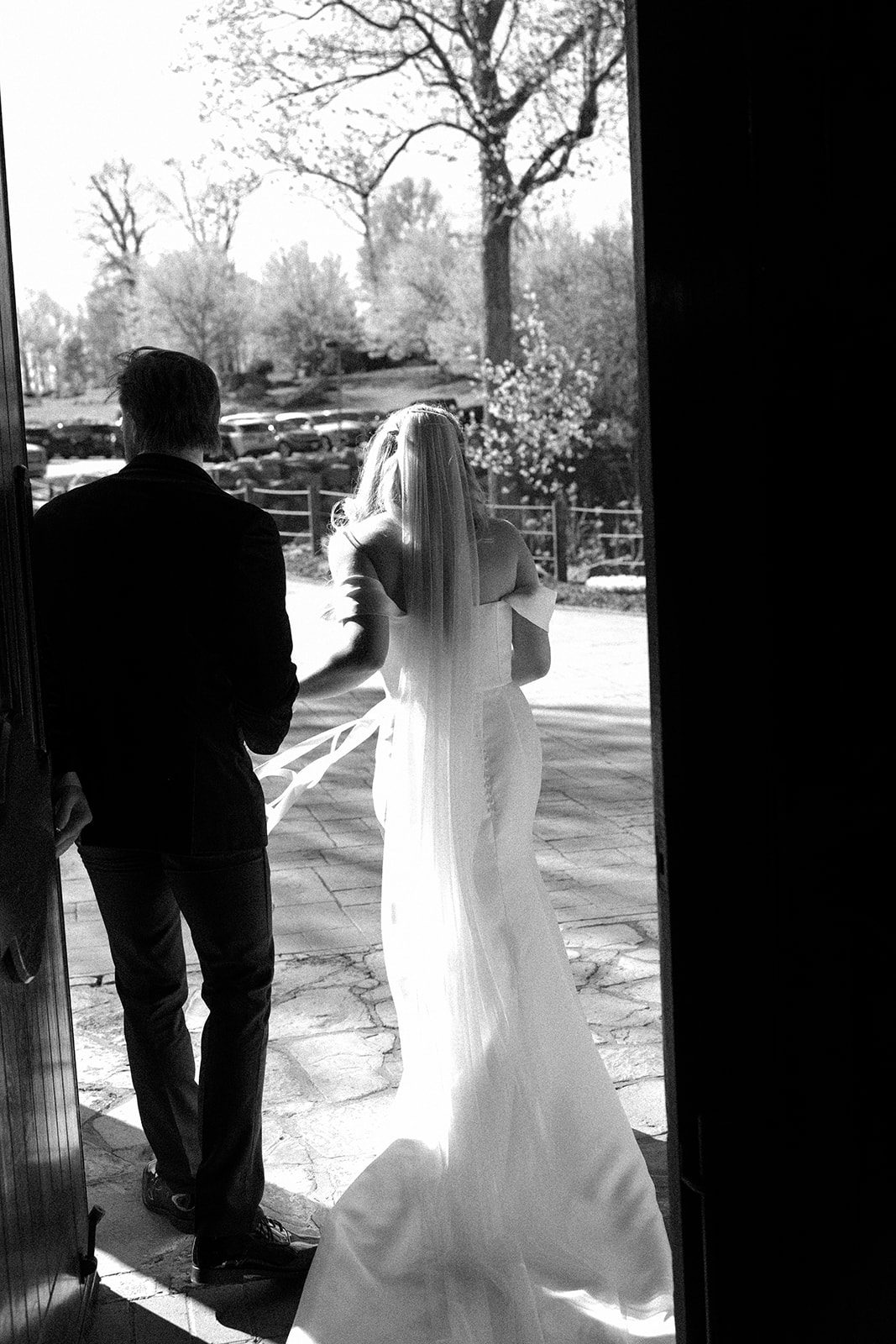 bride and groom leaving glassy chapel