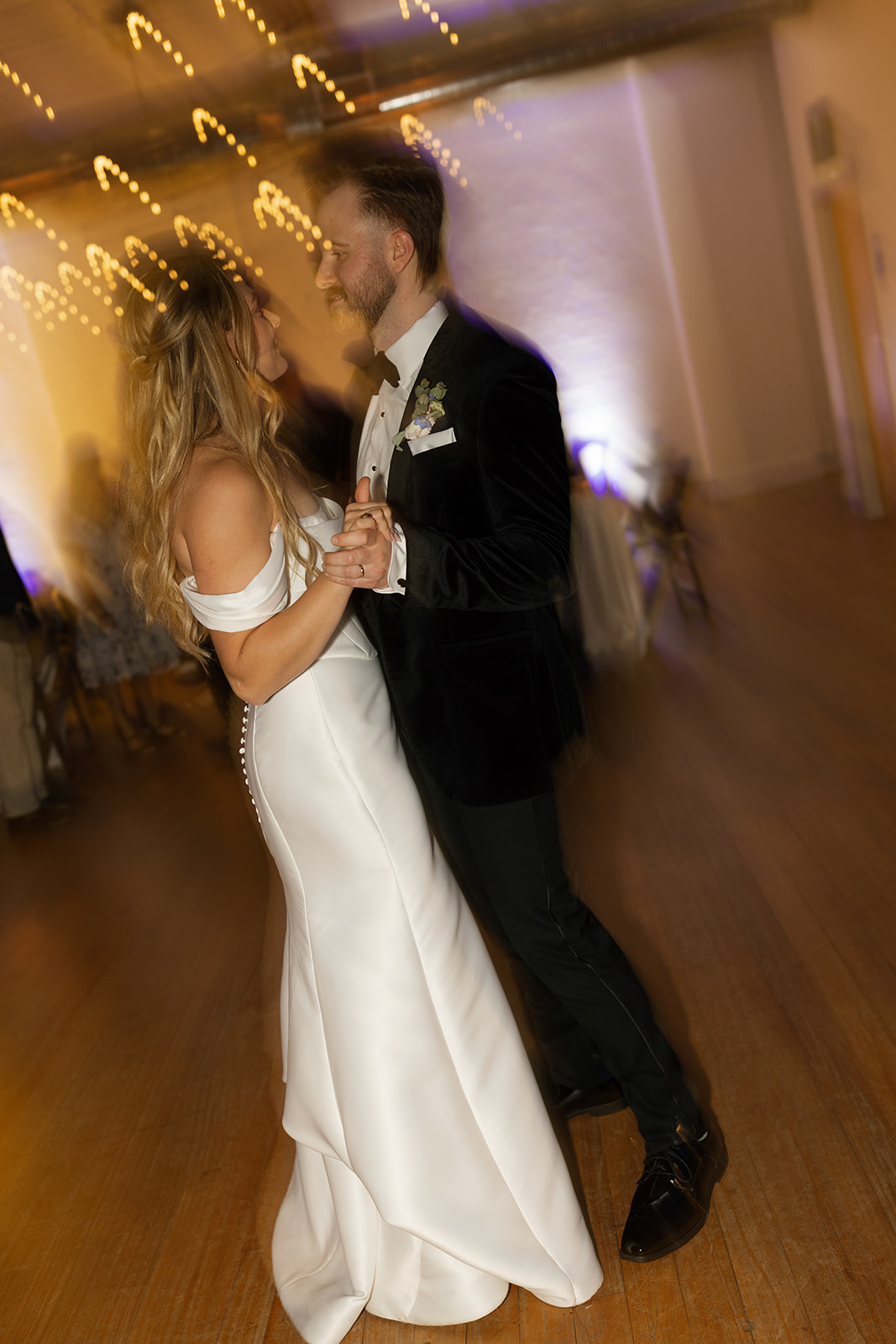 True to color wedding photo of bride and groom sharing their first dance