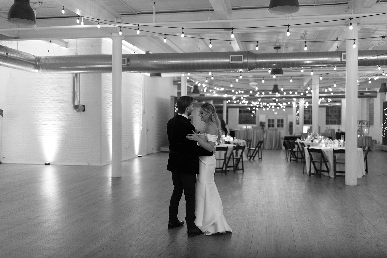 bride and groom share the last dance of the night taken by a wedding photographer in South Carolina