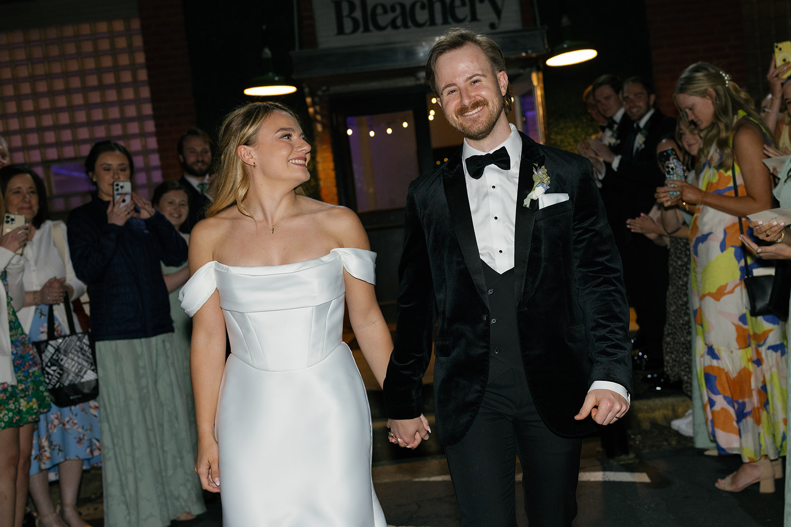 bride looks loving at her new husband as they exit their wedding in South Carolina