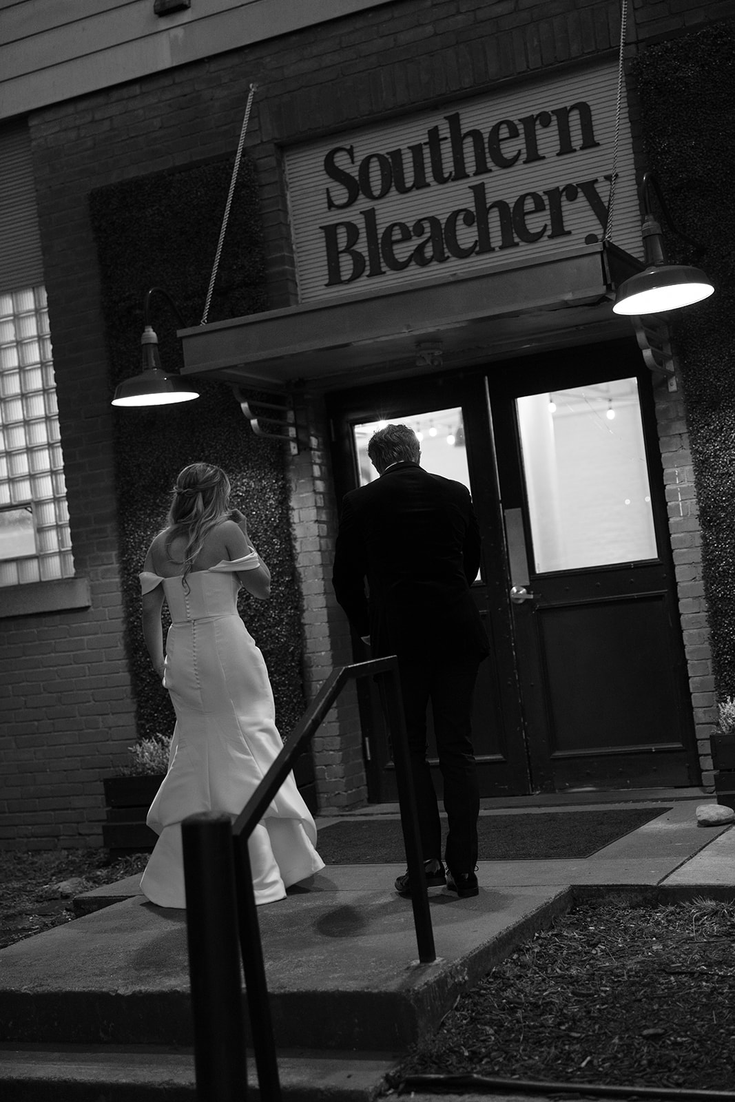 bride and groom walking into the reception venue 