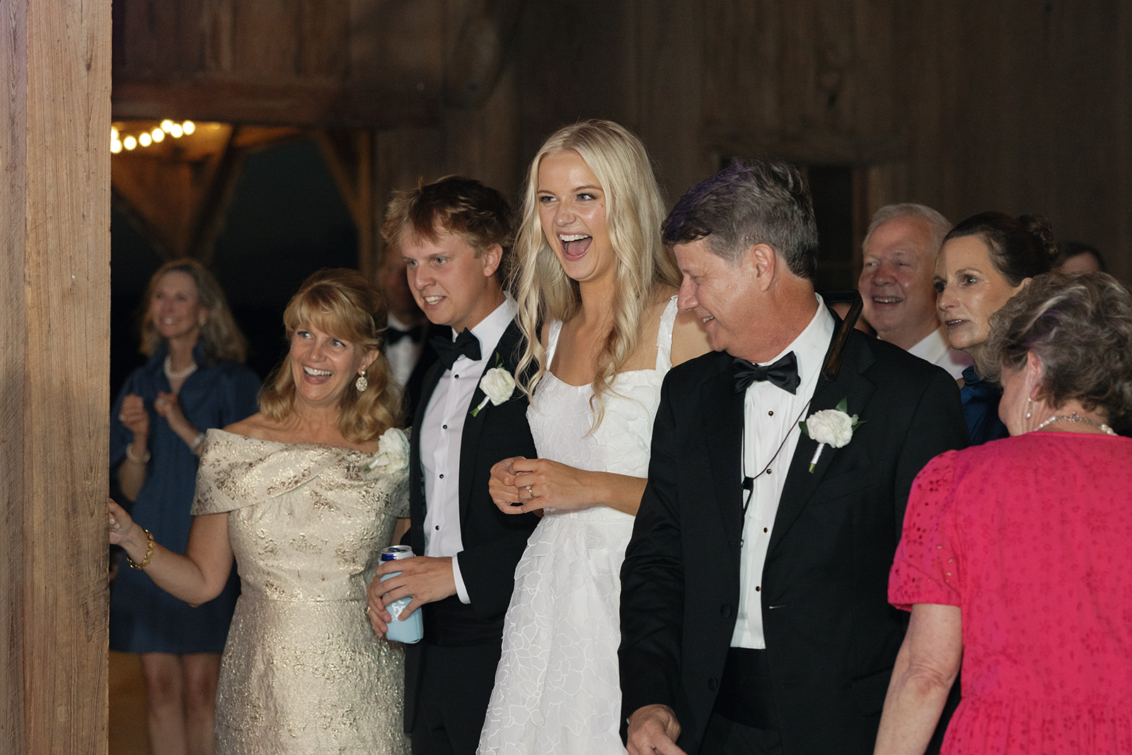 Bride and her family look on with joy