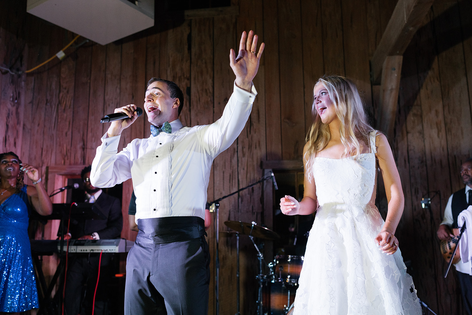 Newlyweds sing together on the stage at Boone Hall Plantation