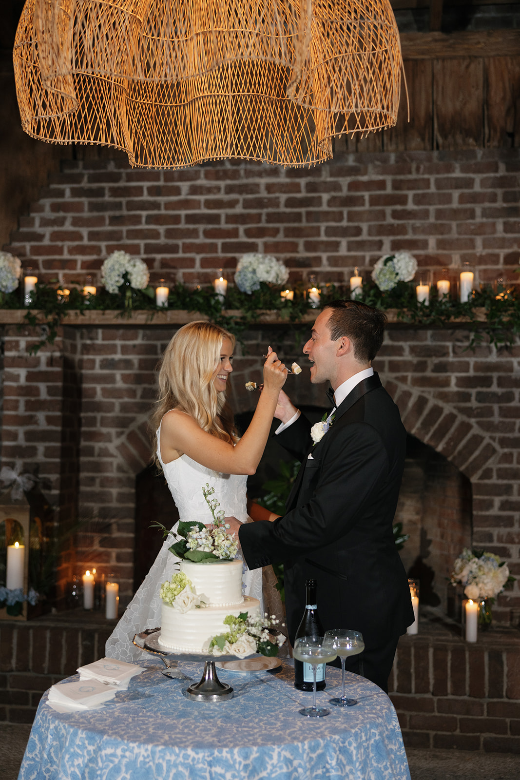 Bride and groom sharing their wedding cake