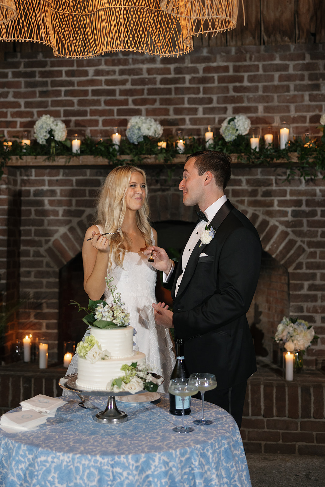 Bride and groom sharing their wedding cake