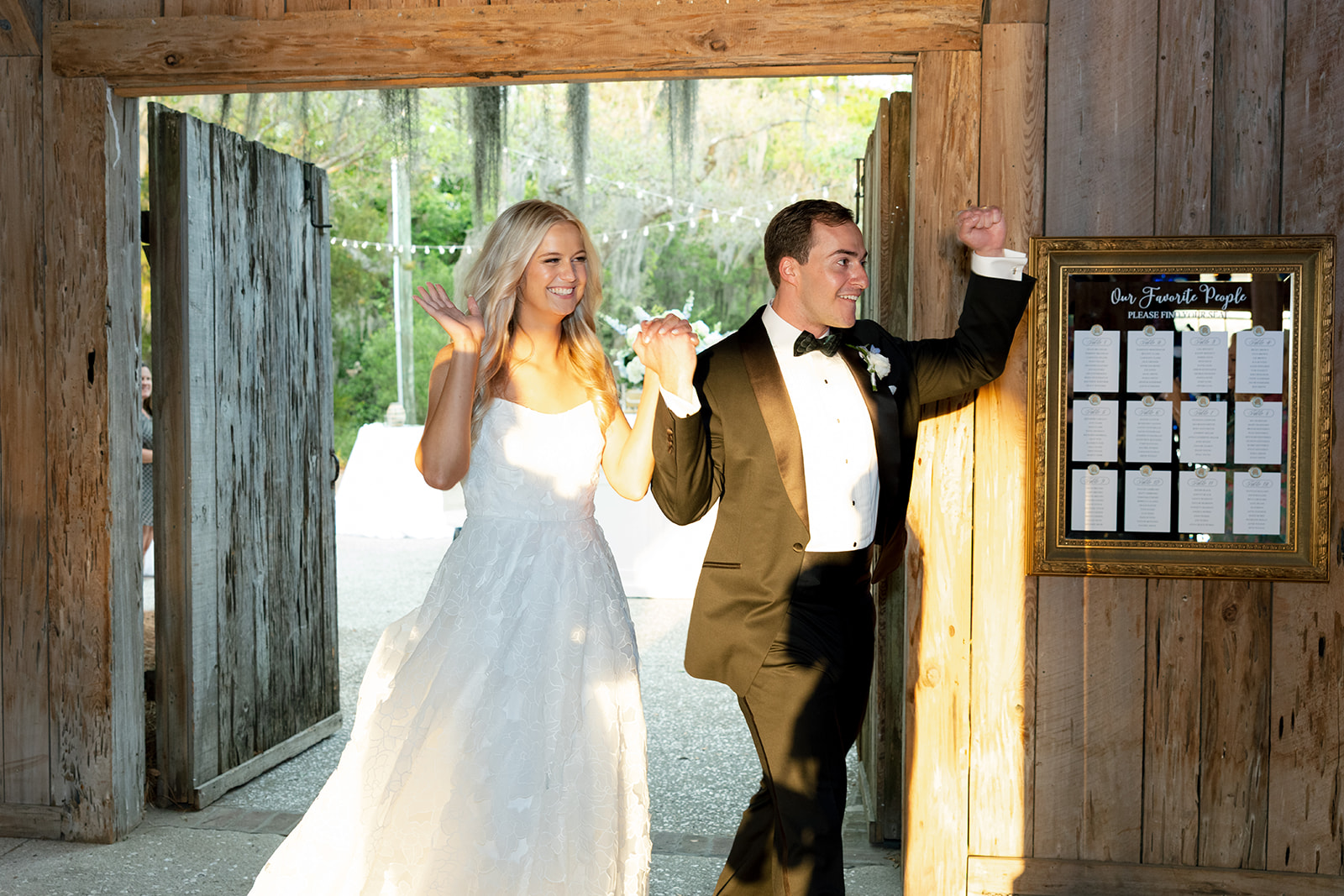 newlyweds enter their wedding reception