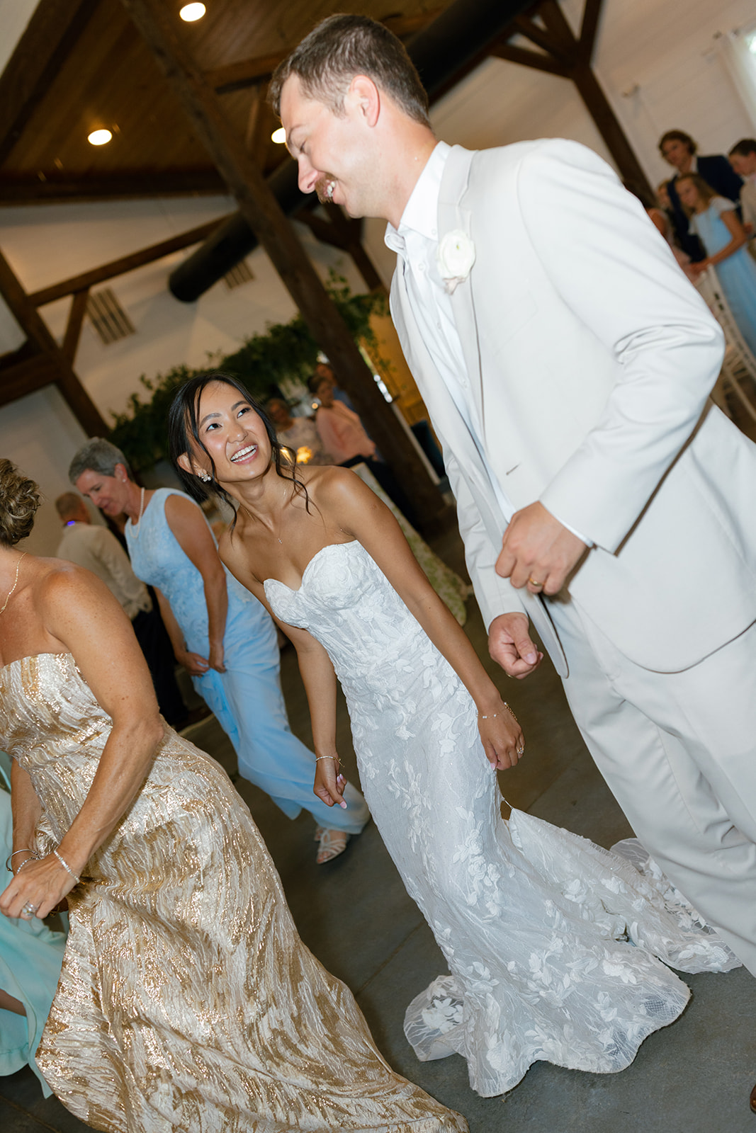 bride smiles at groom as they dance at their South Carolina Wedding reception