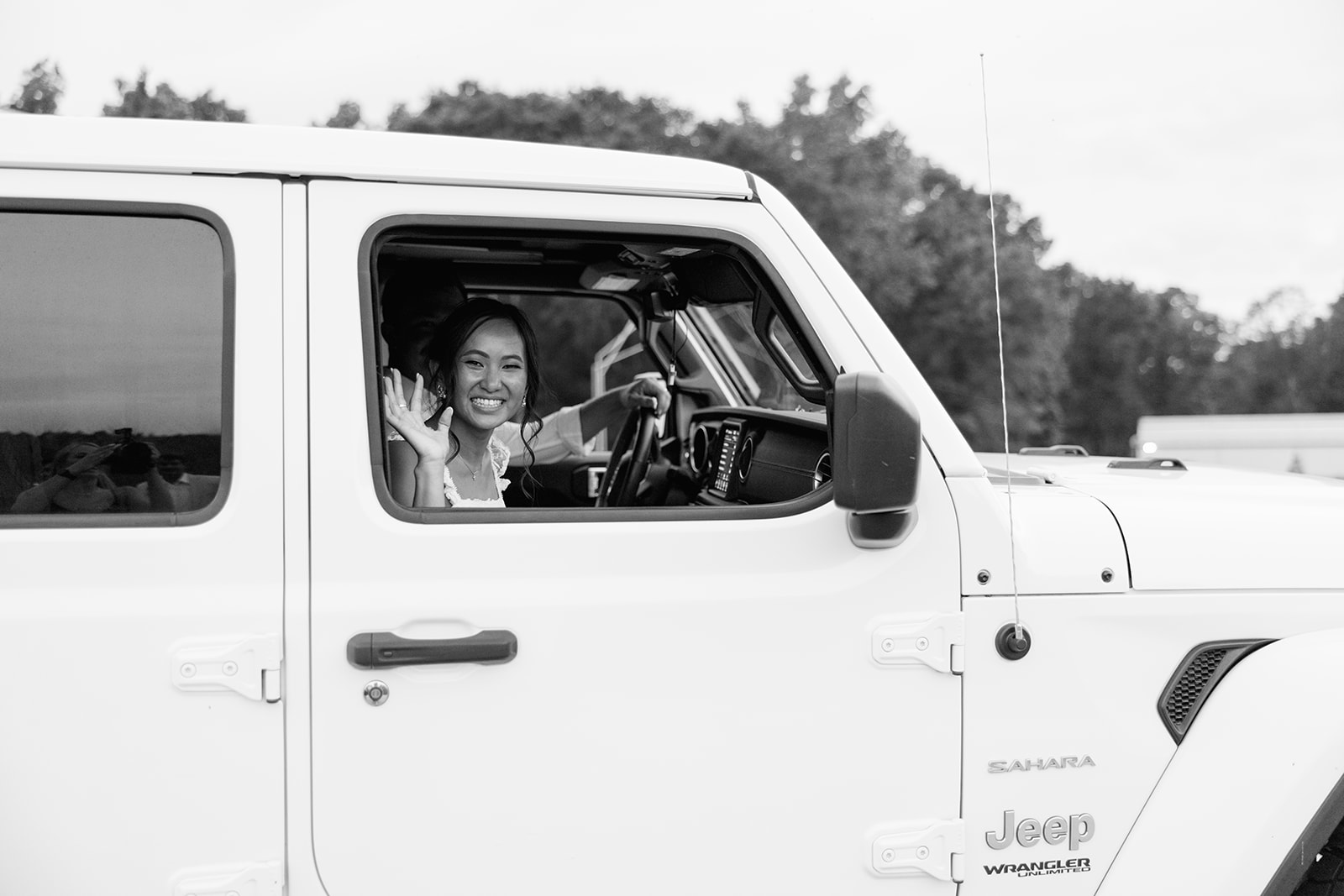 bride waving goodbye to her South Carolina wedding guests