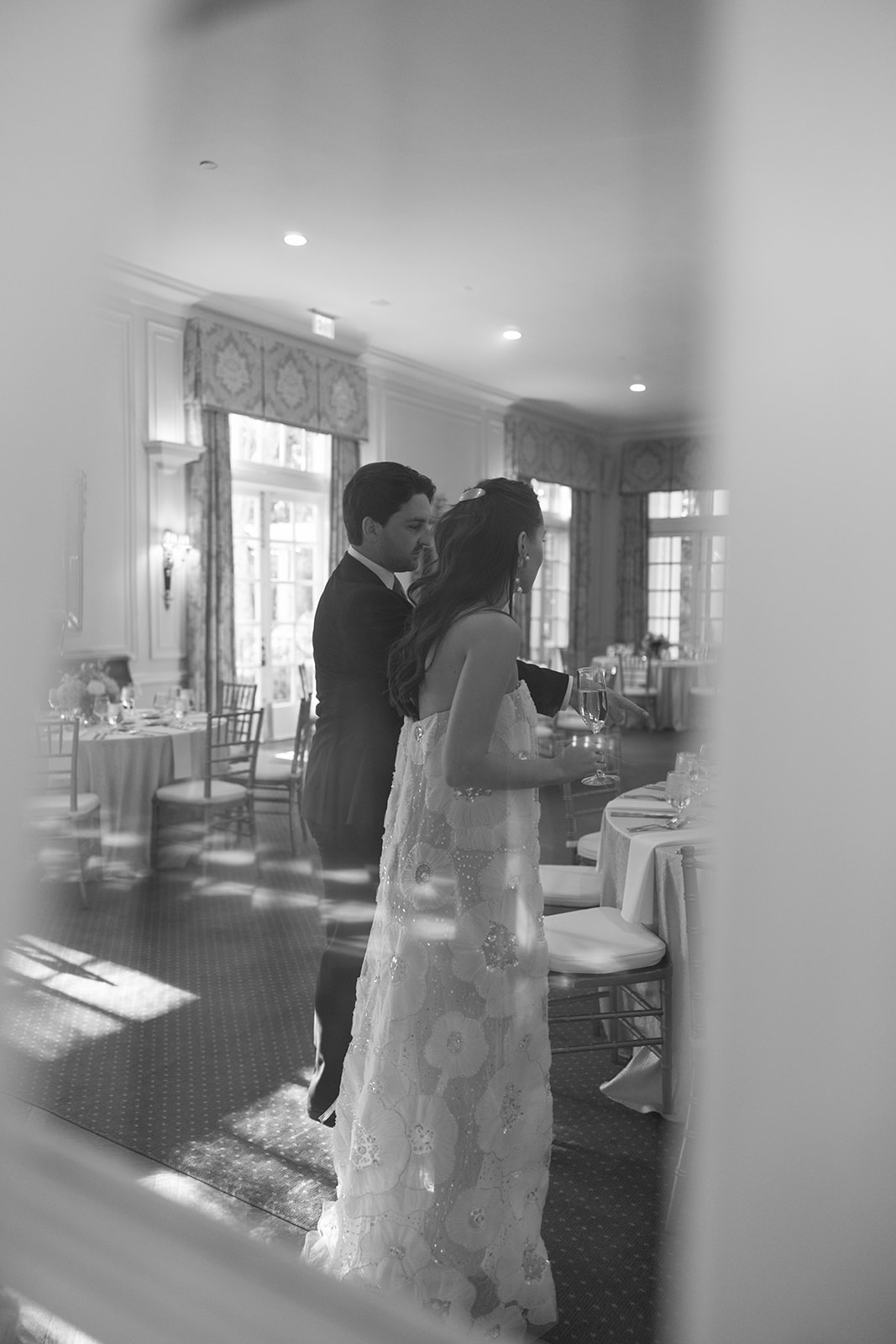 black and white shot of the bride and groom at their rehearsal dinner
