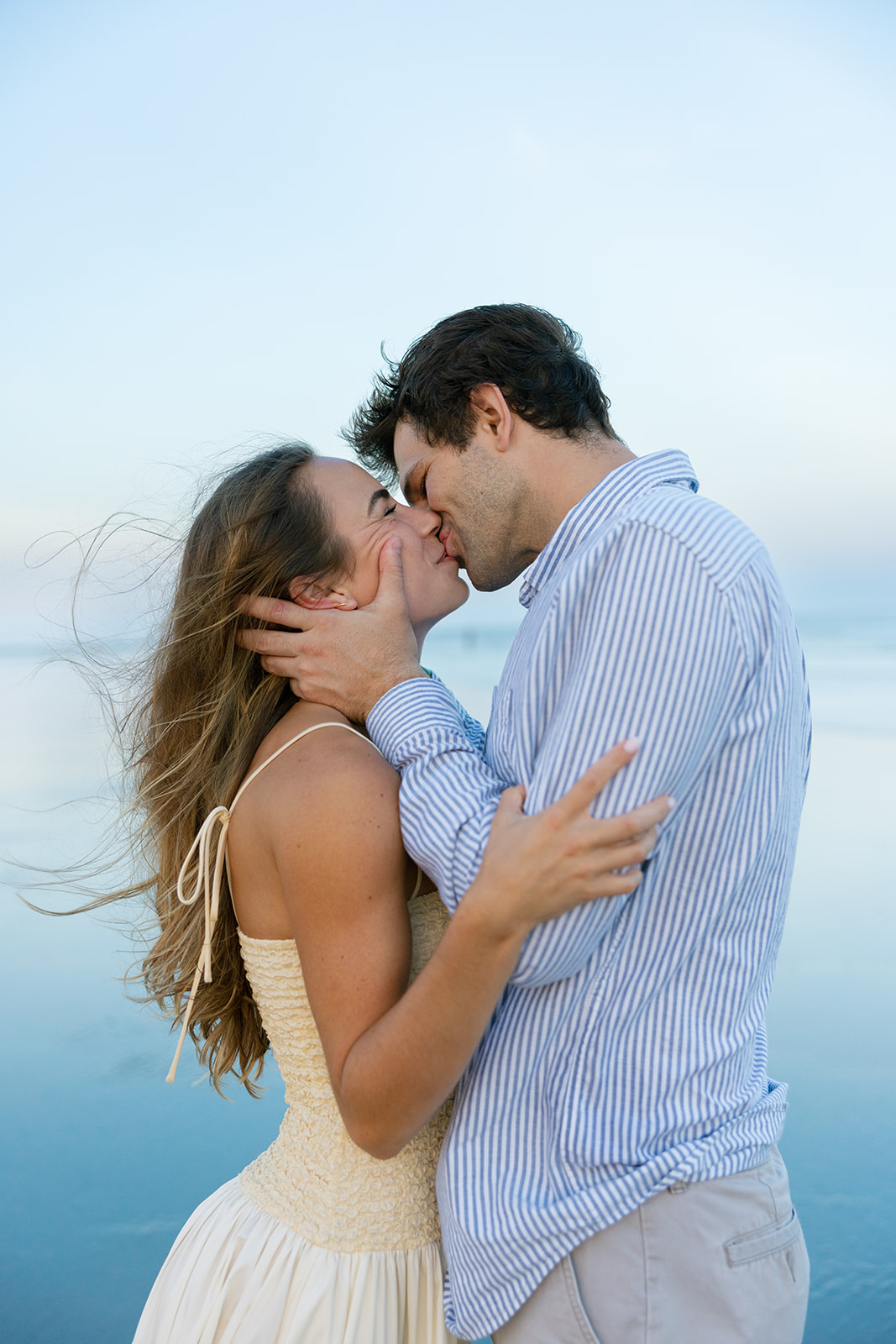Romantic kiss during Charleston engagement session on the beach