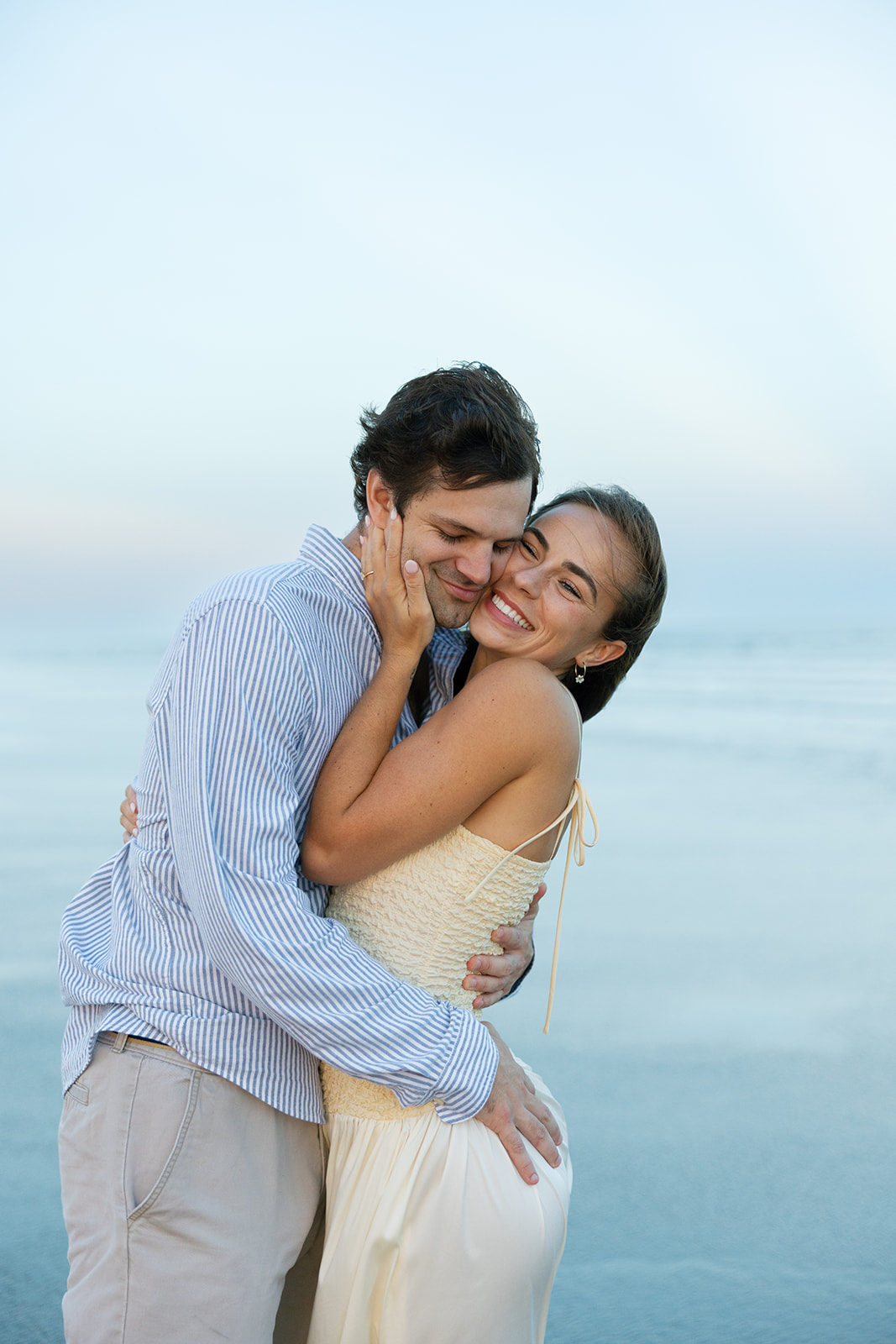 The bride-to-be embraces her fiancé during their Charleston SC engagement photos