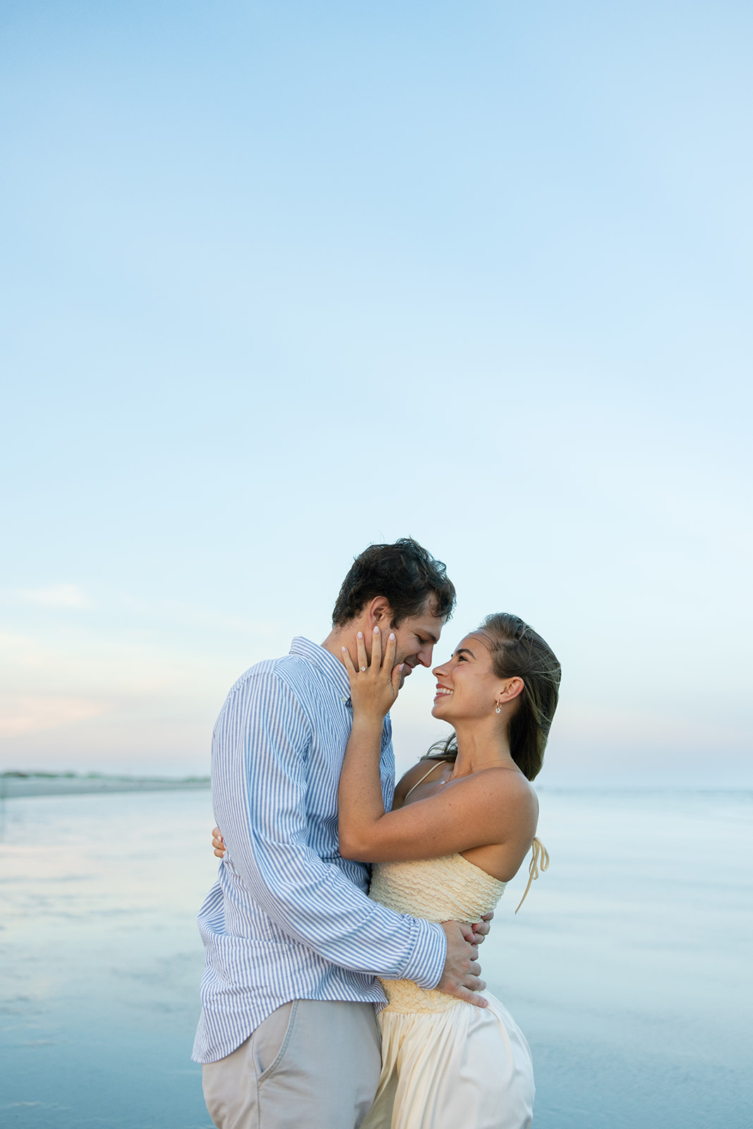 The bride-to-be hugs her fiancé during their Charleston SC engagement photos