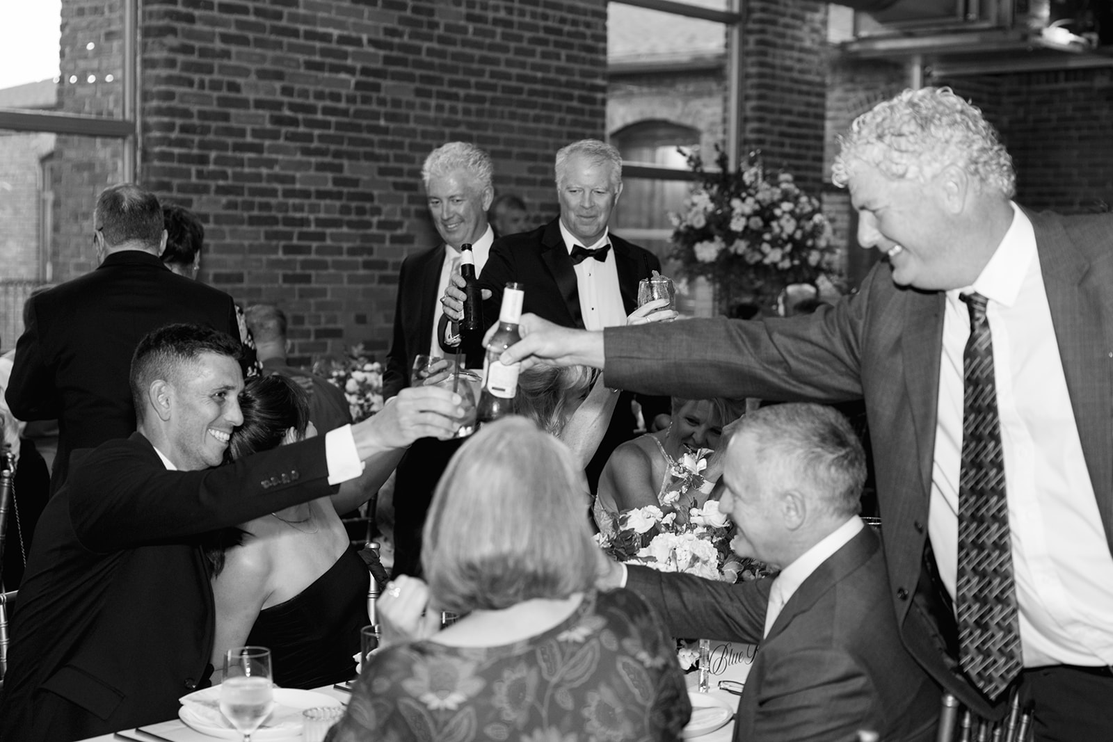 wedding guests cheers in joyful moment