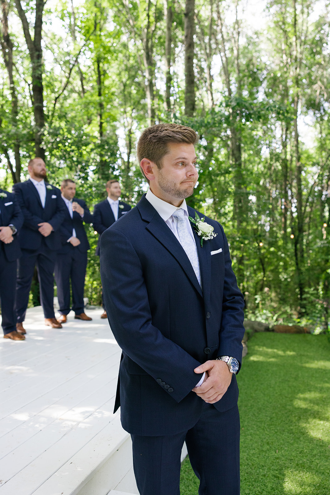 The groom holds back tears as he sees his bride for the first time, a candid wedding photo captured by a Greenville wedding photographer at Edinburgh West.