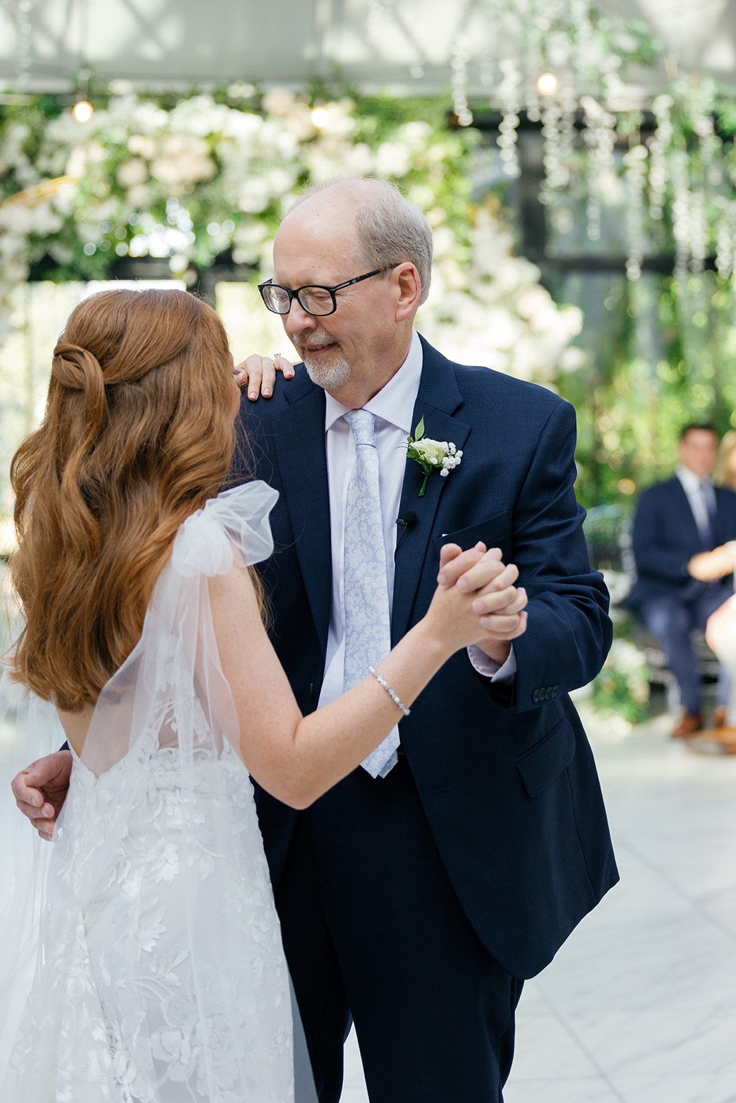 Bride shares a tender father-daughter dance with her dad.