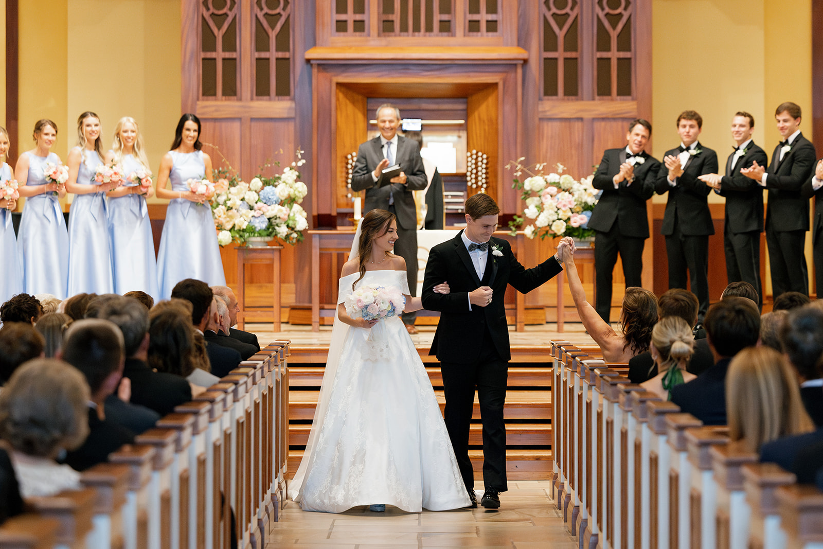 Bride and groom walk down the aisle at Daniel Chapel at Furman University