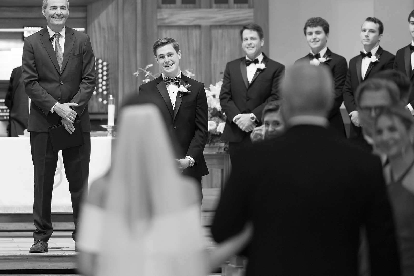 Bride and her father walk down the aisle at Daniel Chapel at Furman University