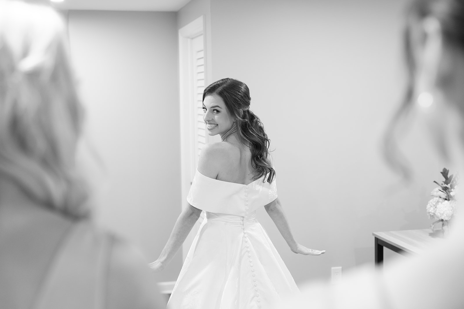 The bride and her bridesmaids share a sweet moment at an Airbnb in Greenville, South Carolina