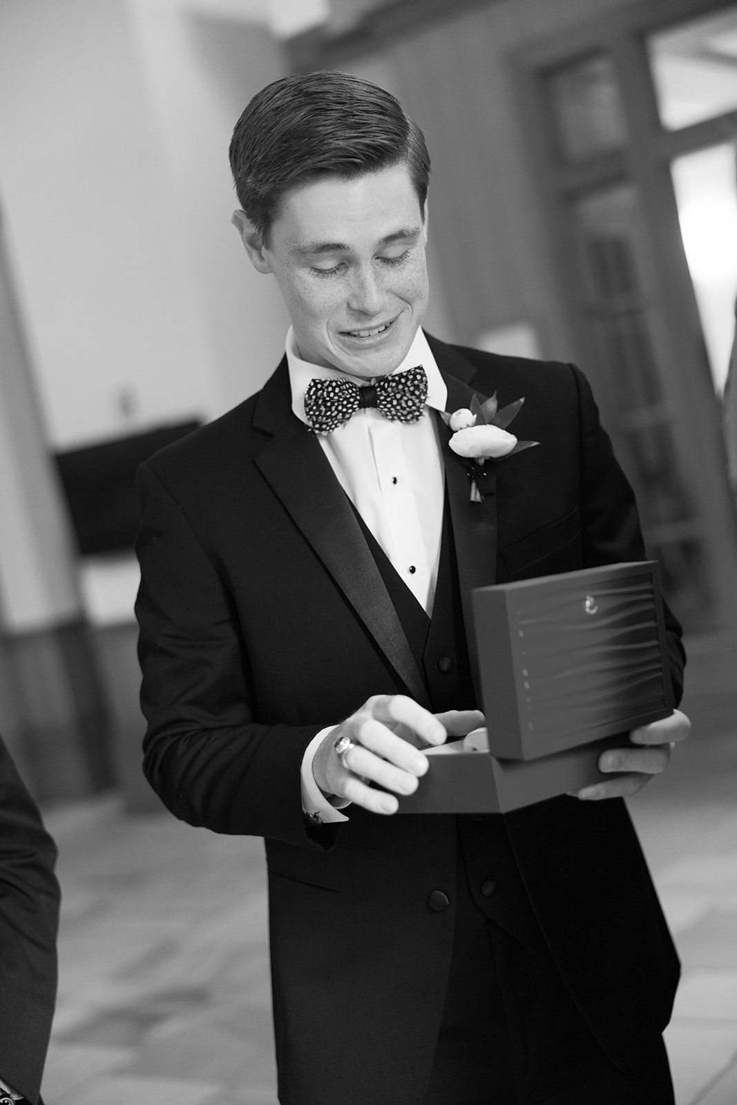 Groom opens a new watch before his South Carolina wedding