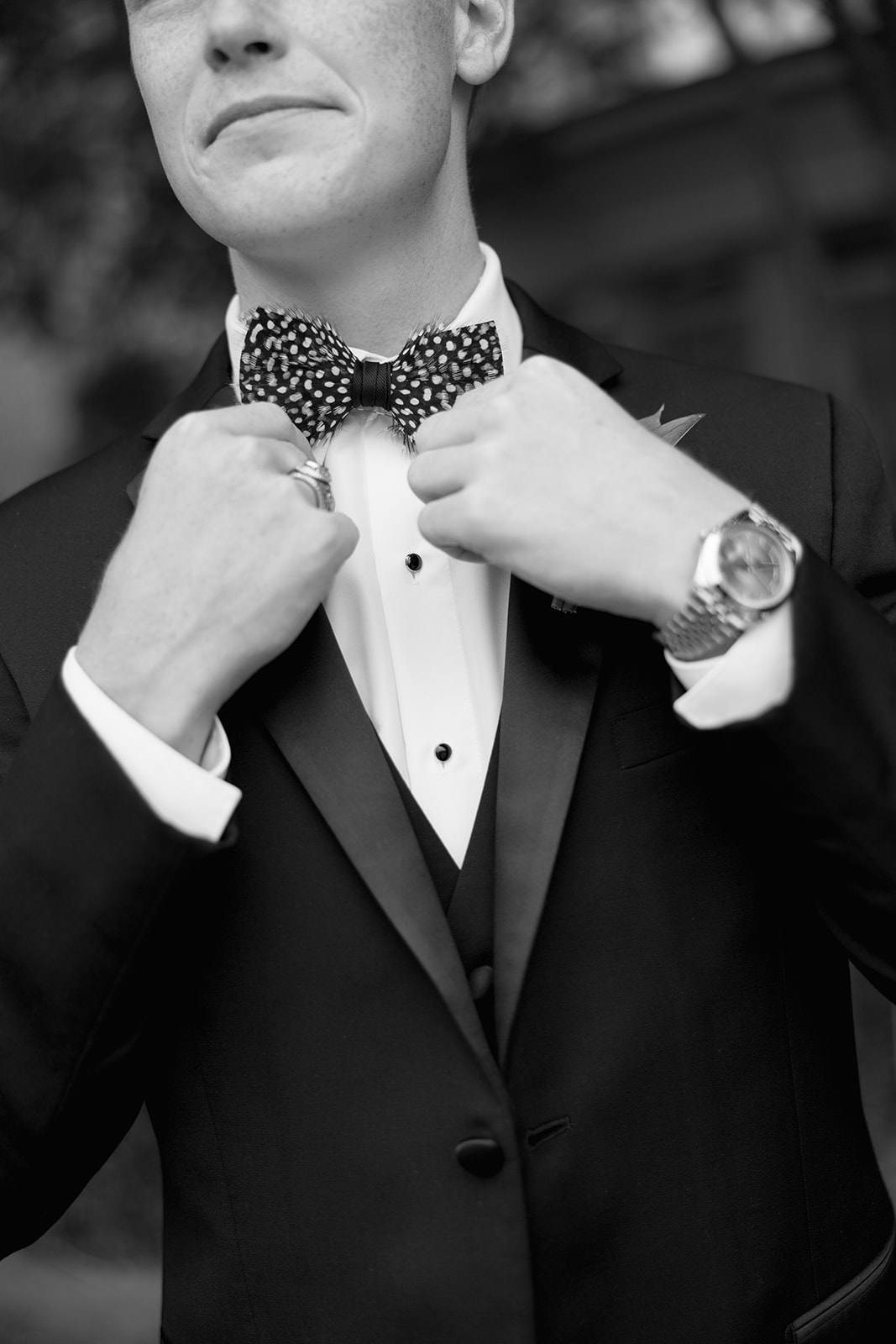 Groom straightens his tie before his South Carolina wedding