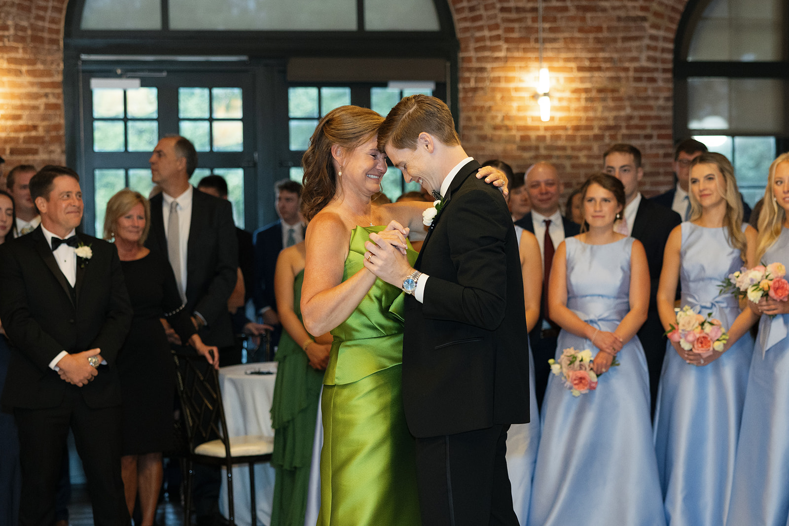 The mother of the groom shares a dance with him at the Greenville SC wedding