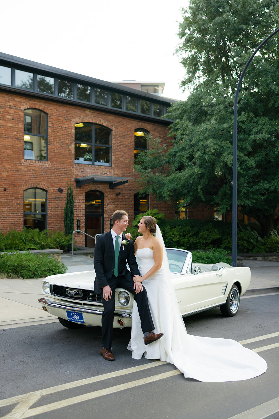 bride and groom portraits with their vintage car in Greenville, SC