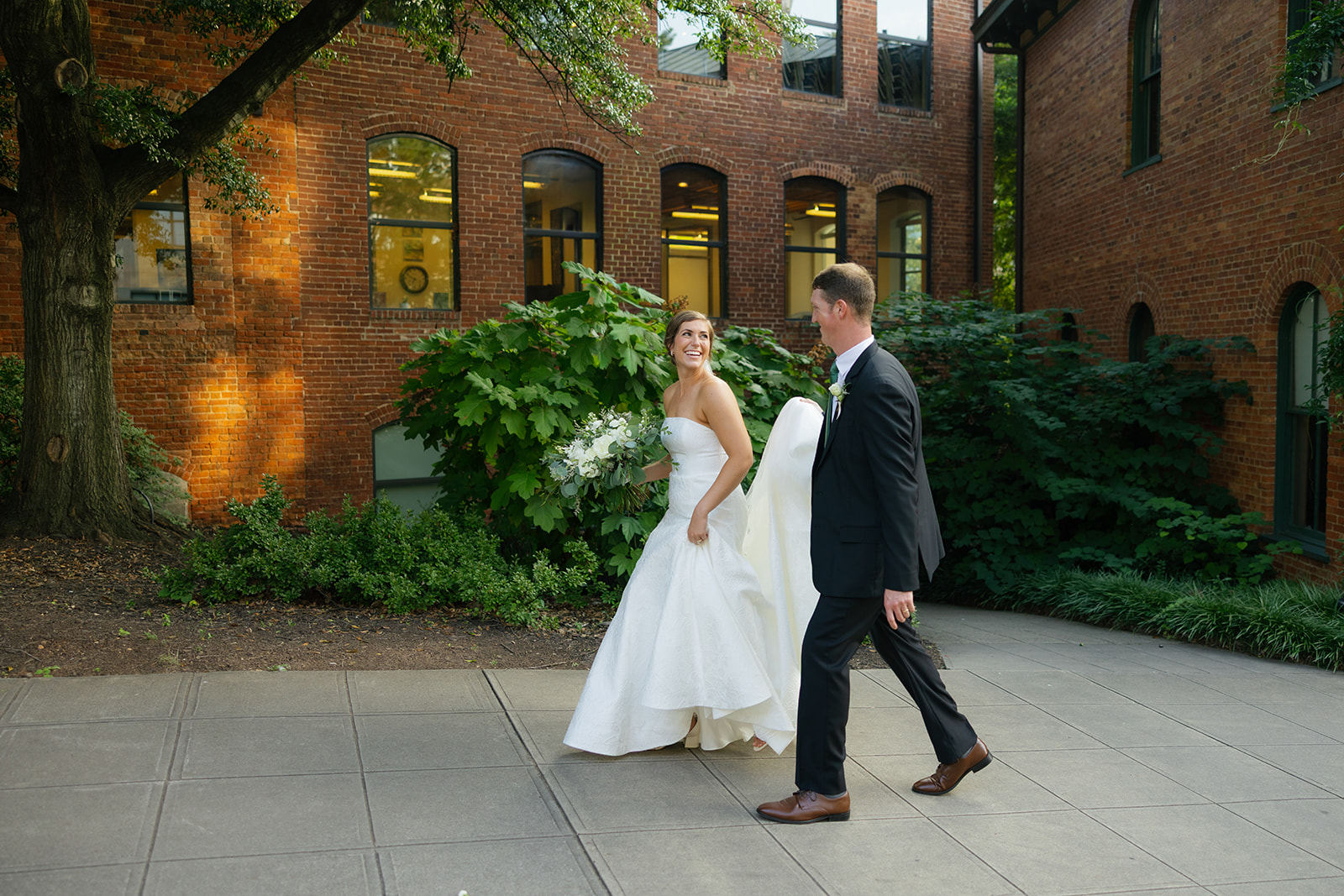 the bride and groom walking together 
