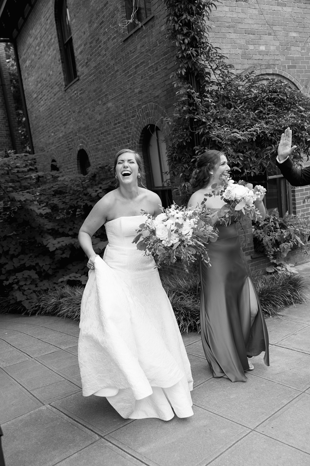 the bride laughing with her family during the family portrait portion of the Wedding Photography Timeline