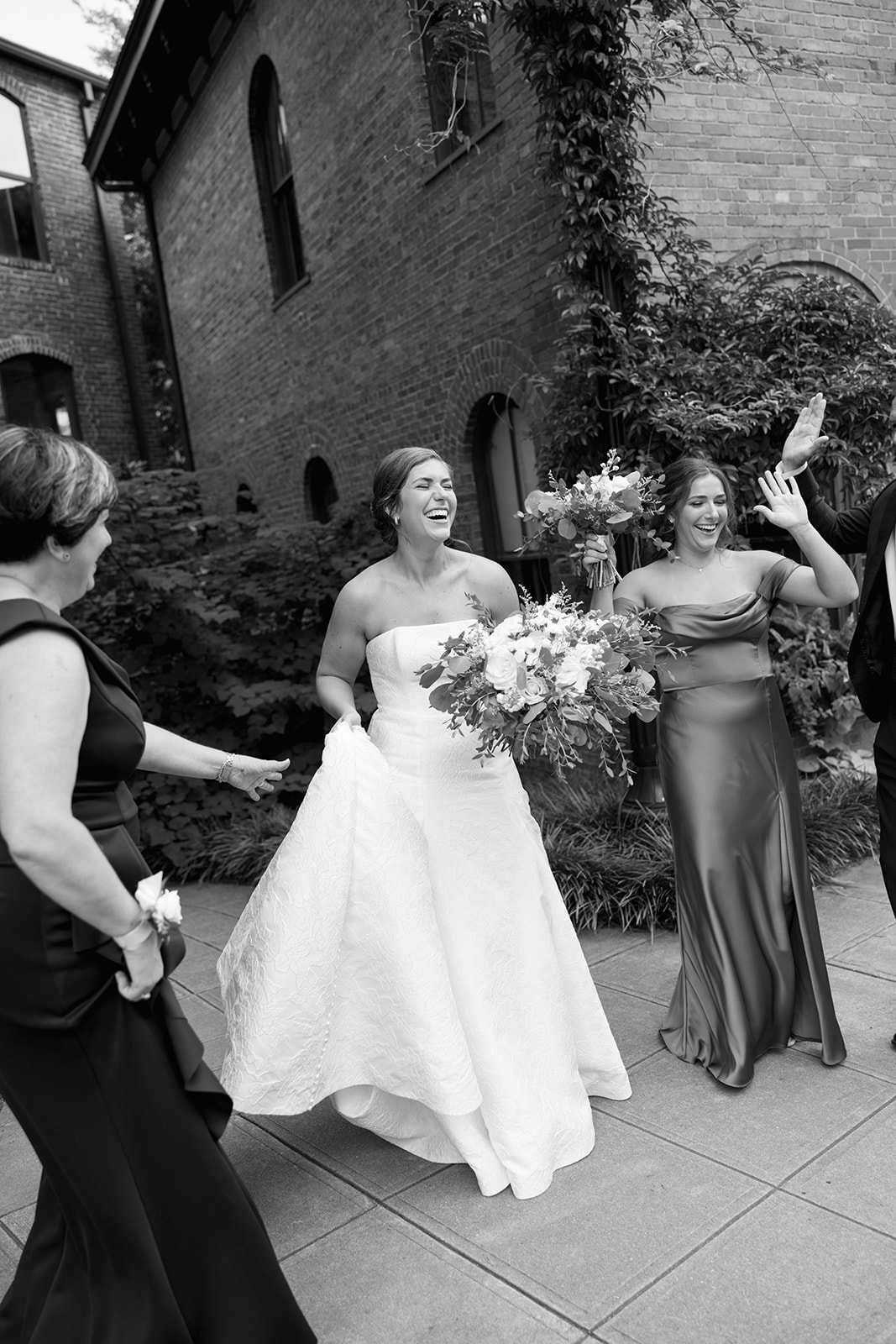 a candid wedding photo during the  family portrait portion of the Wedding Photography Timeline